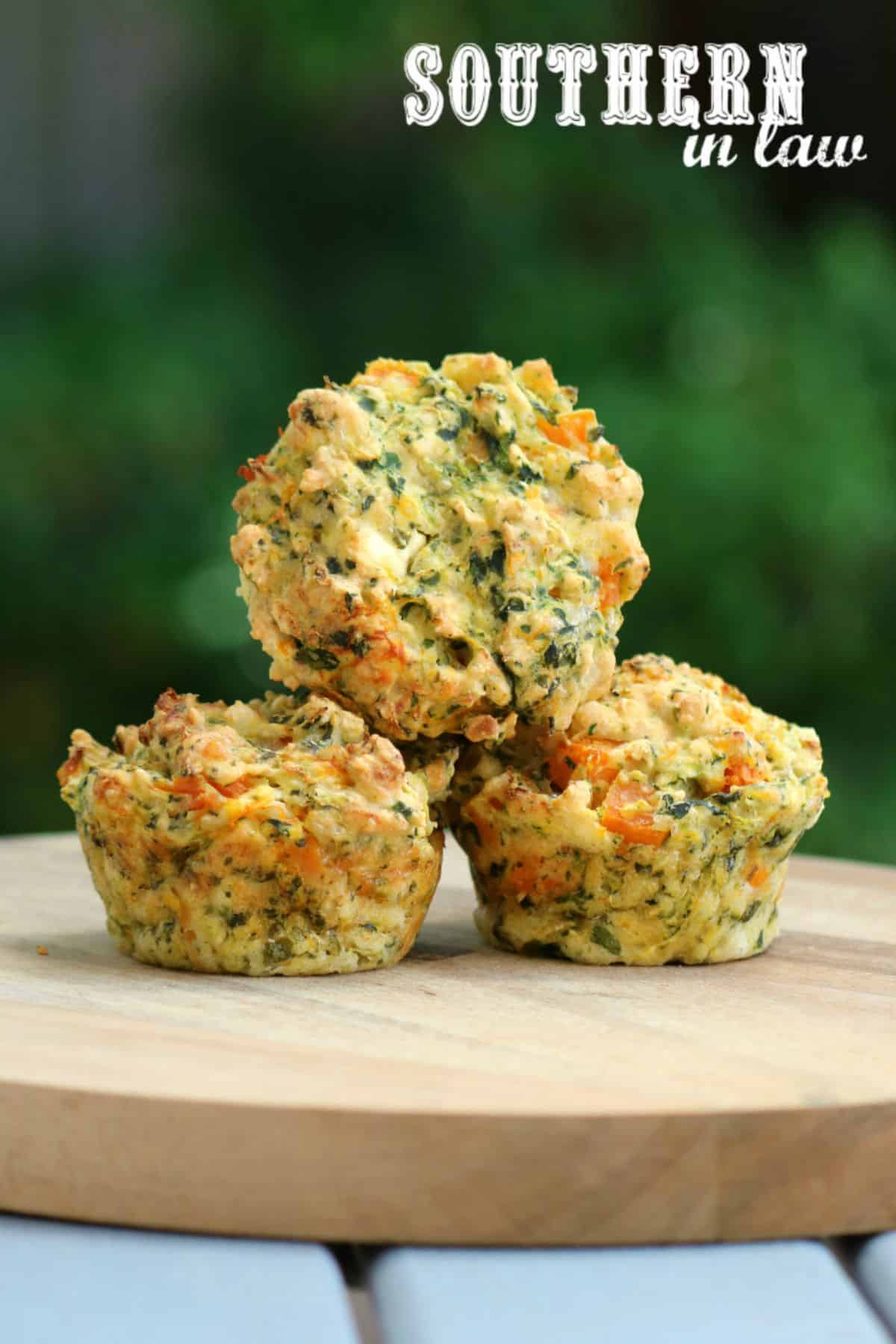 Gluten-Free Pumpkin, Spinach, and Feta Muffins on a wooden tray.