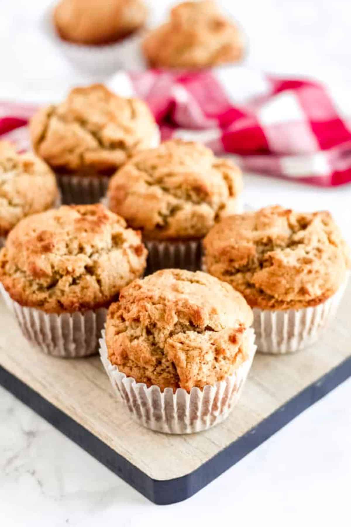 Delicious Gluten-Free Peanut Butter Muffins on a wooden tray.