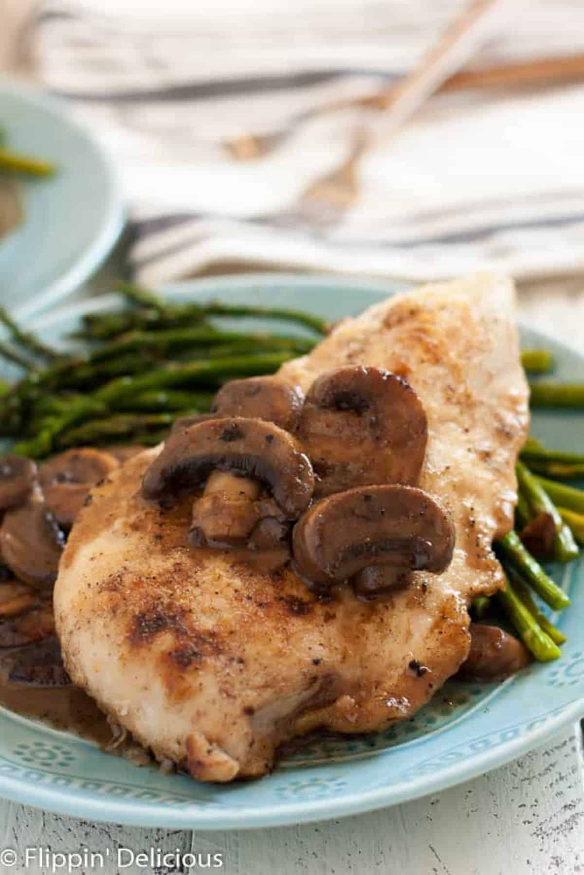 Gluten-Free Chicken Marsala With Mushrooms on a blue plate.