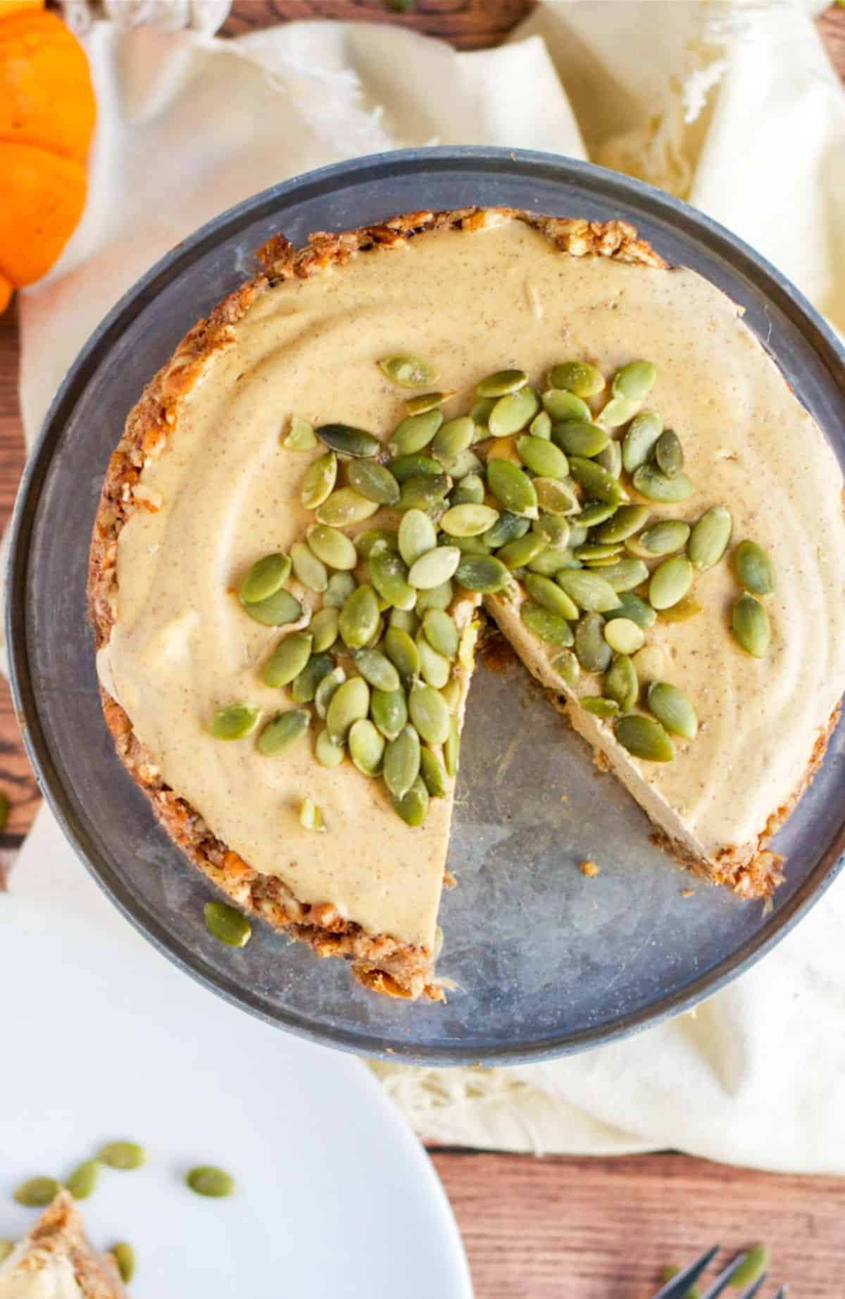 Vegan Pumpkin Cheesecake on a gray tray.