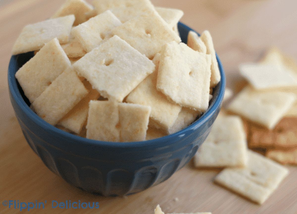 Crispy White Cheddar Crackers in a blue bowl.
