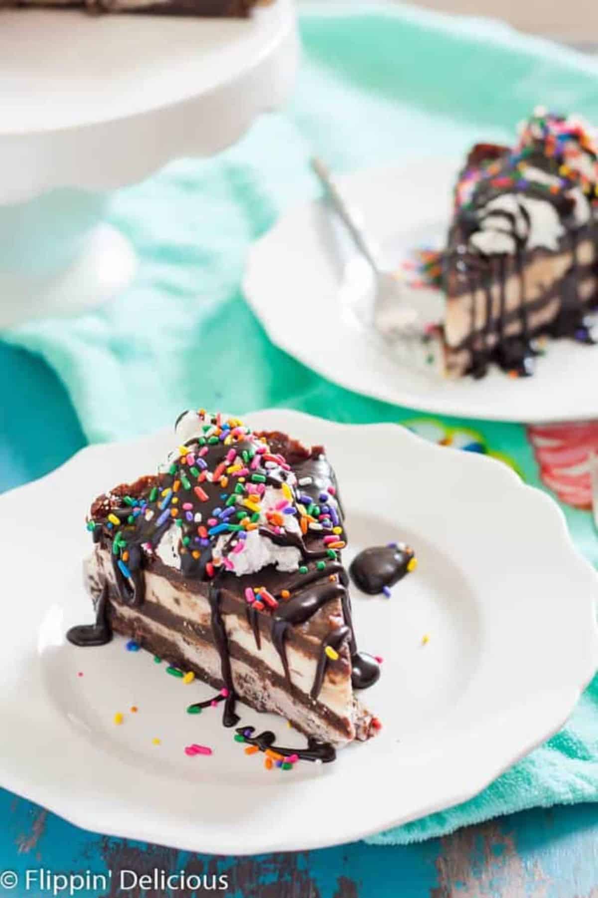 A piece of Vegan Brownie Ice Cream Cake on a white plate.