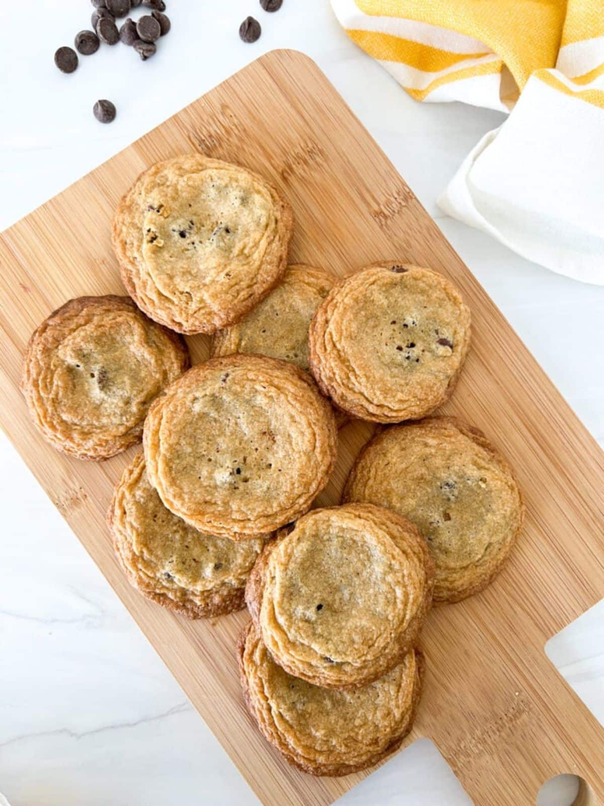 Cassava Flour Chocolate Chip Cookies on a wooden cutting board.