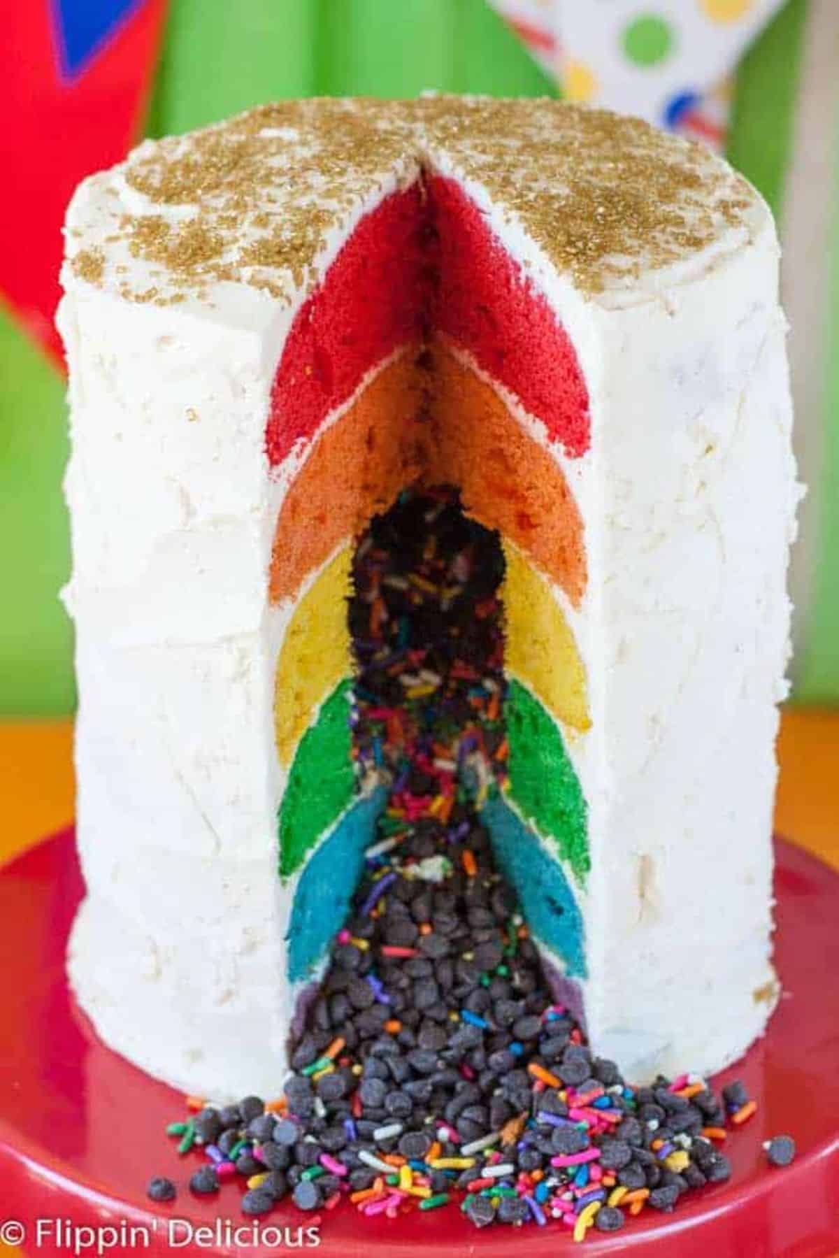Delicious Gluten-Free Rainbow Cake on a cake tray.