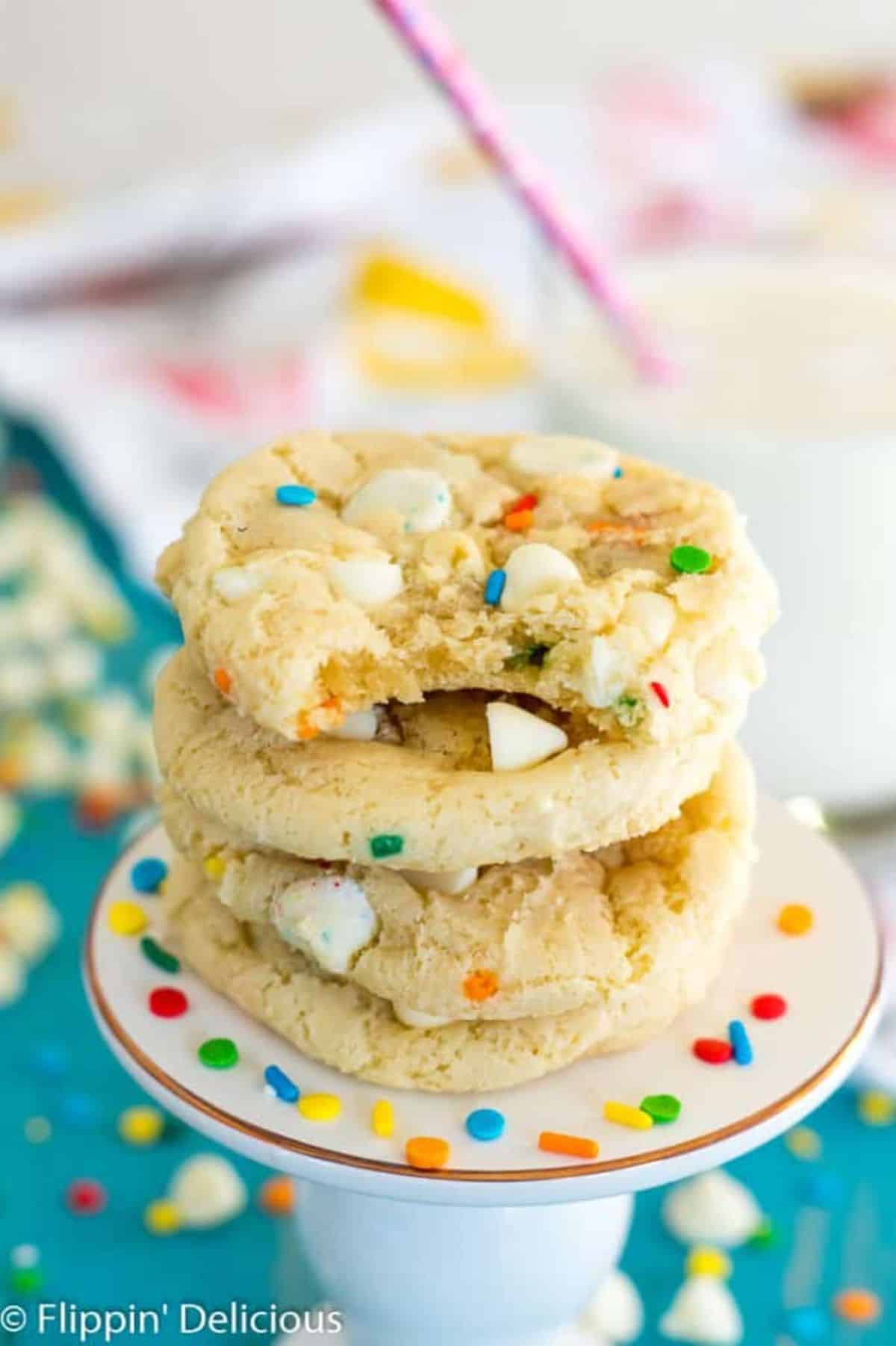 A pile of Gluten-Free Funfetti Cookies on a cake tray.