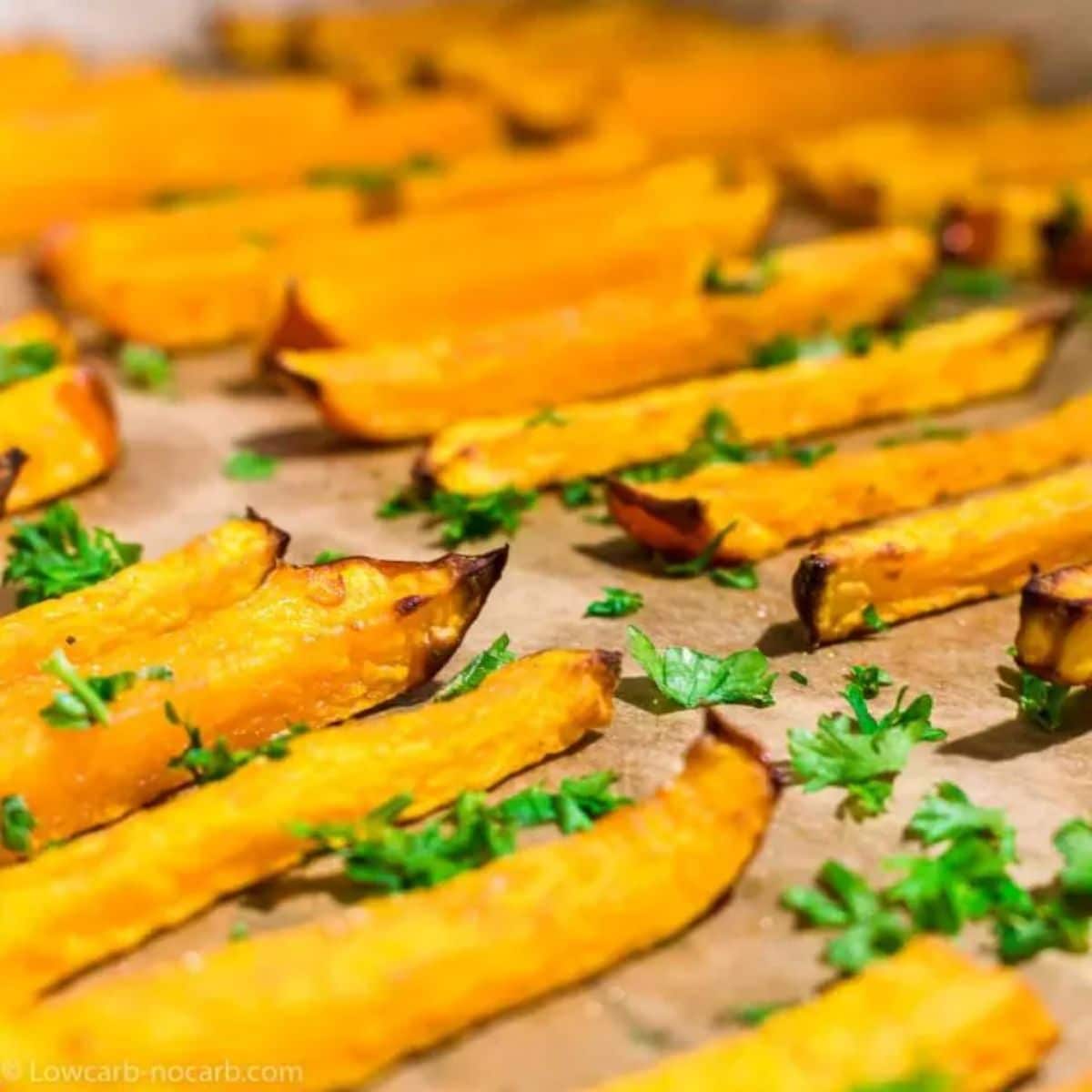 Low-Carb Pumpkin Fries on parchment paper.