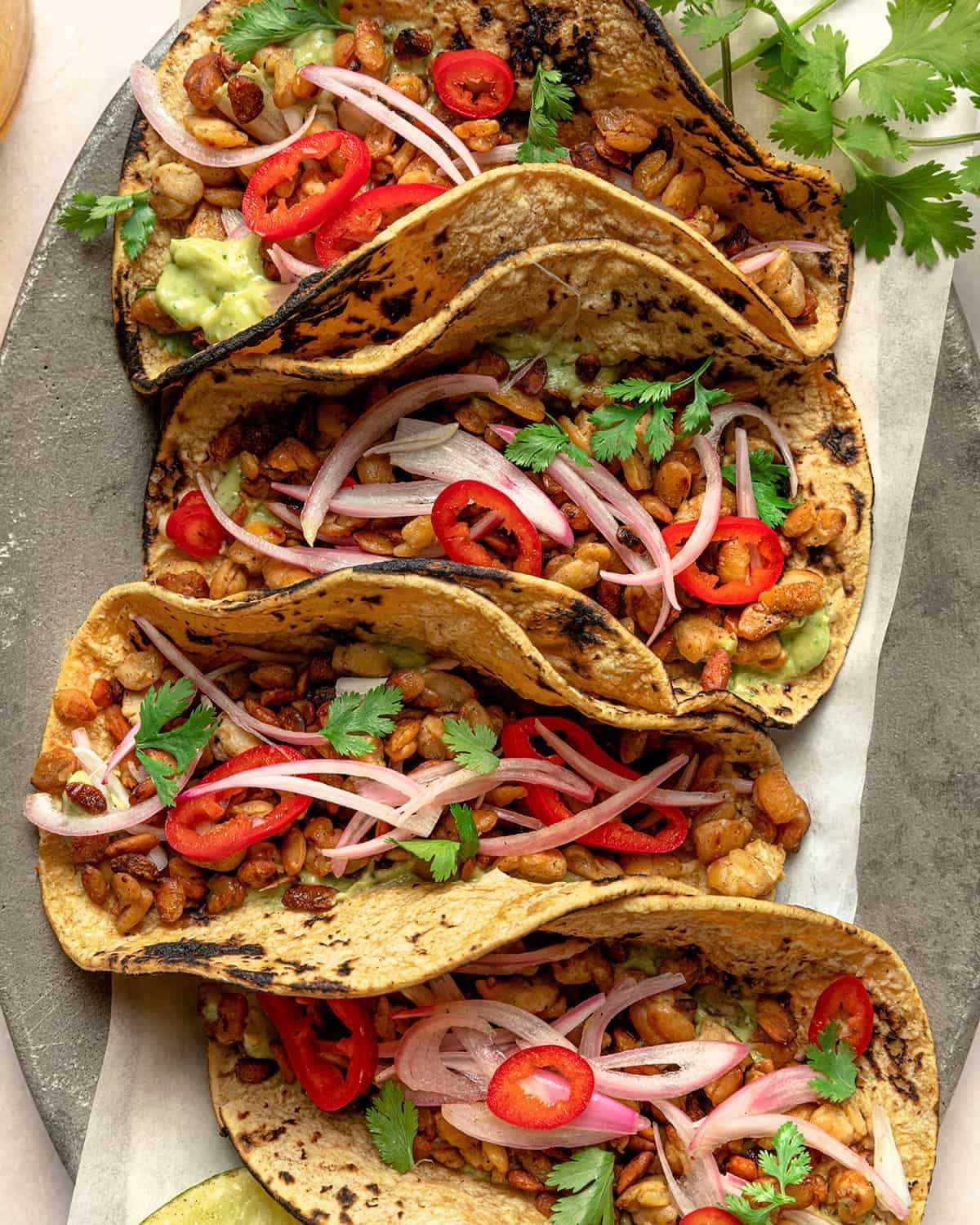 Delicious Tempeh Tacos on a gray tray.