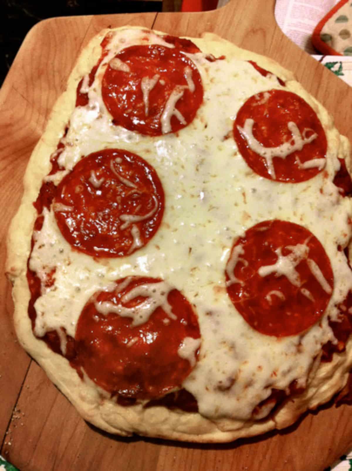 Delicious Gluten-Free Pizza Dough on a wooden tray.