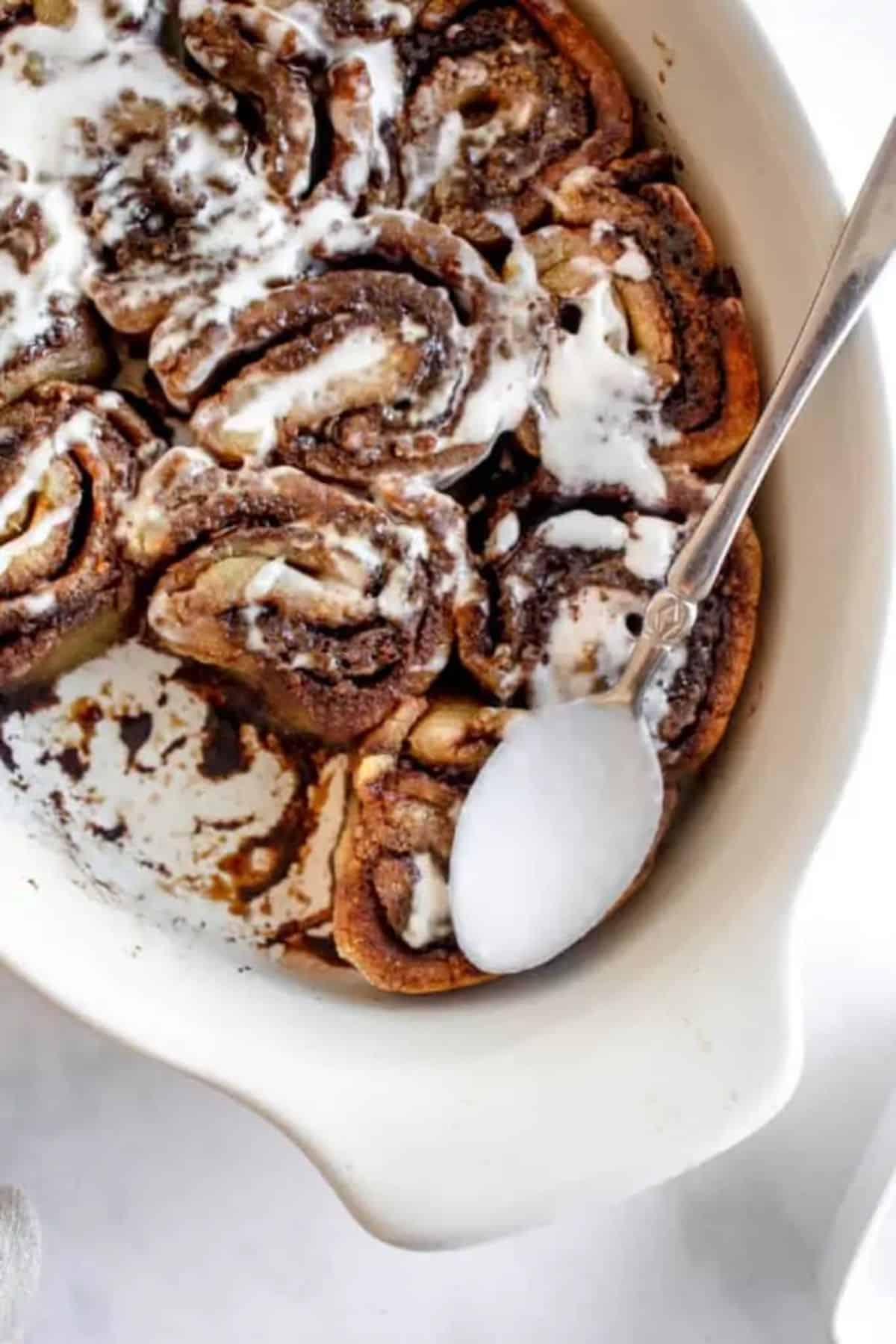 Cassava Flour Cinnamon Rolls in a white casserole.