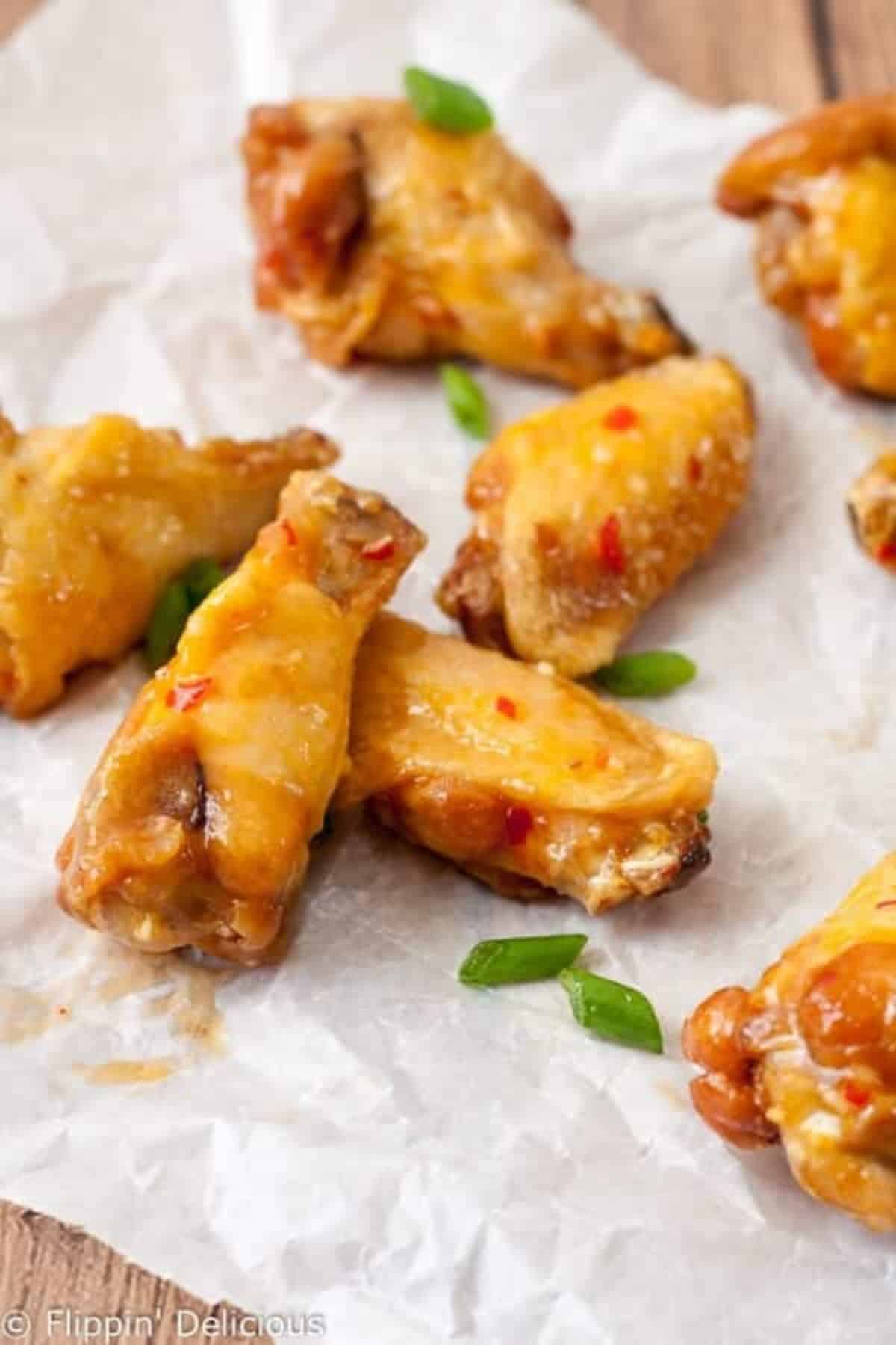 Delicious Sweet Chili Wings on a piece of napkin.