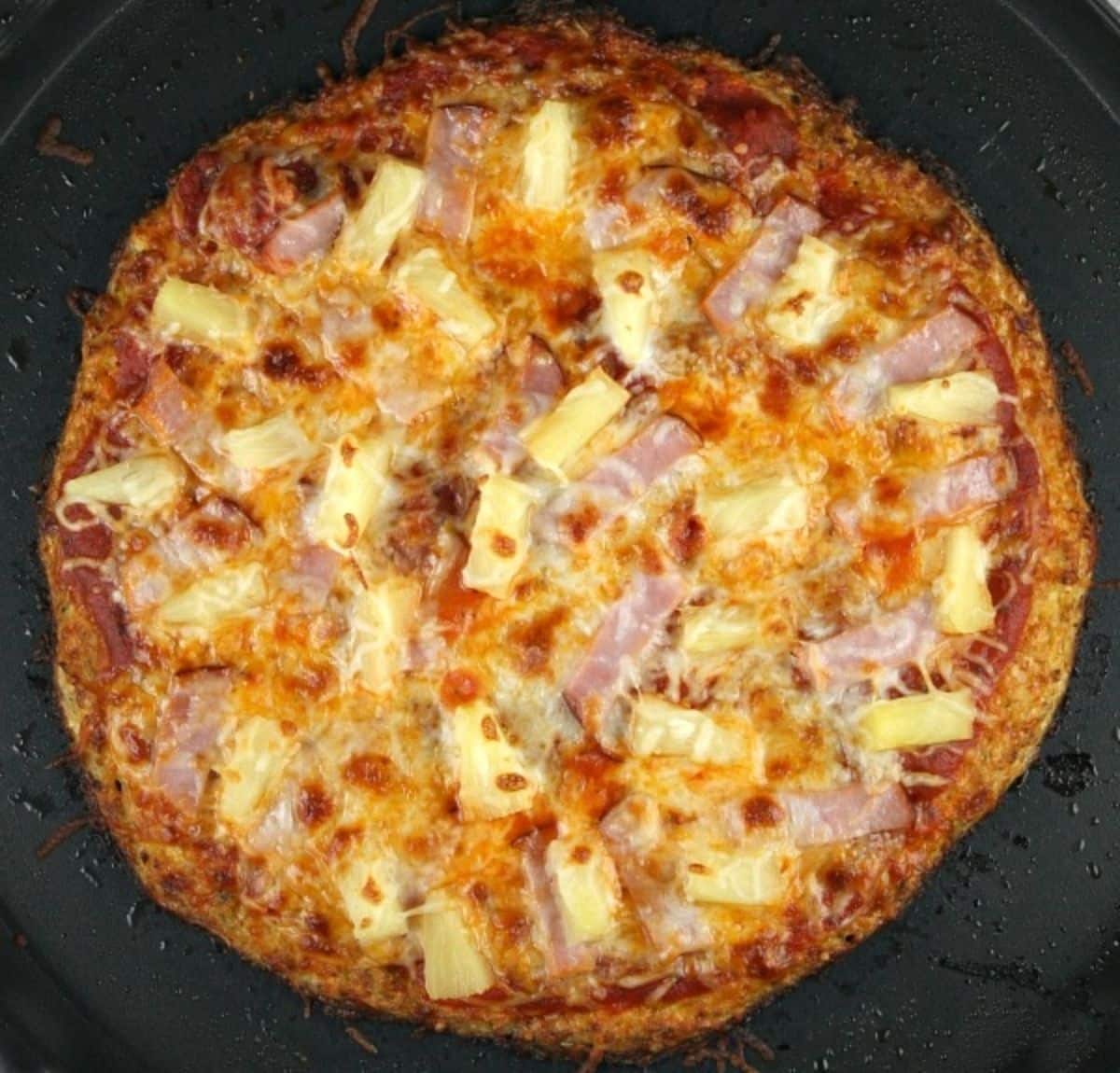 Gluten-free Cauliflower Crust Hawaiian Pizza.