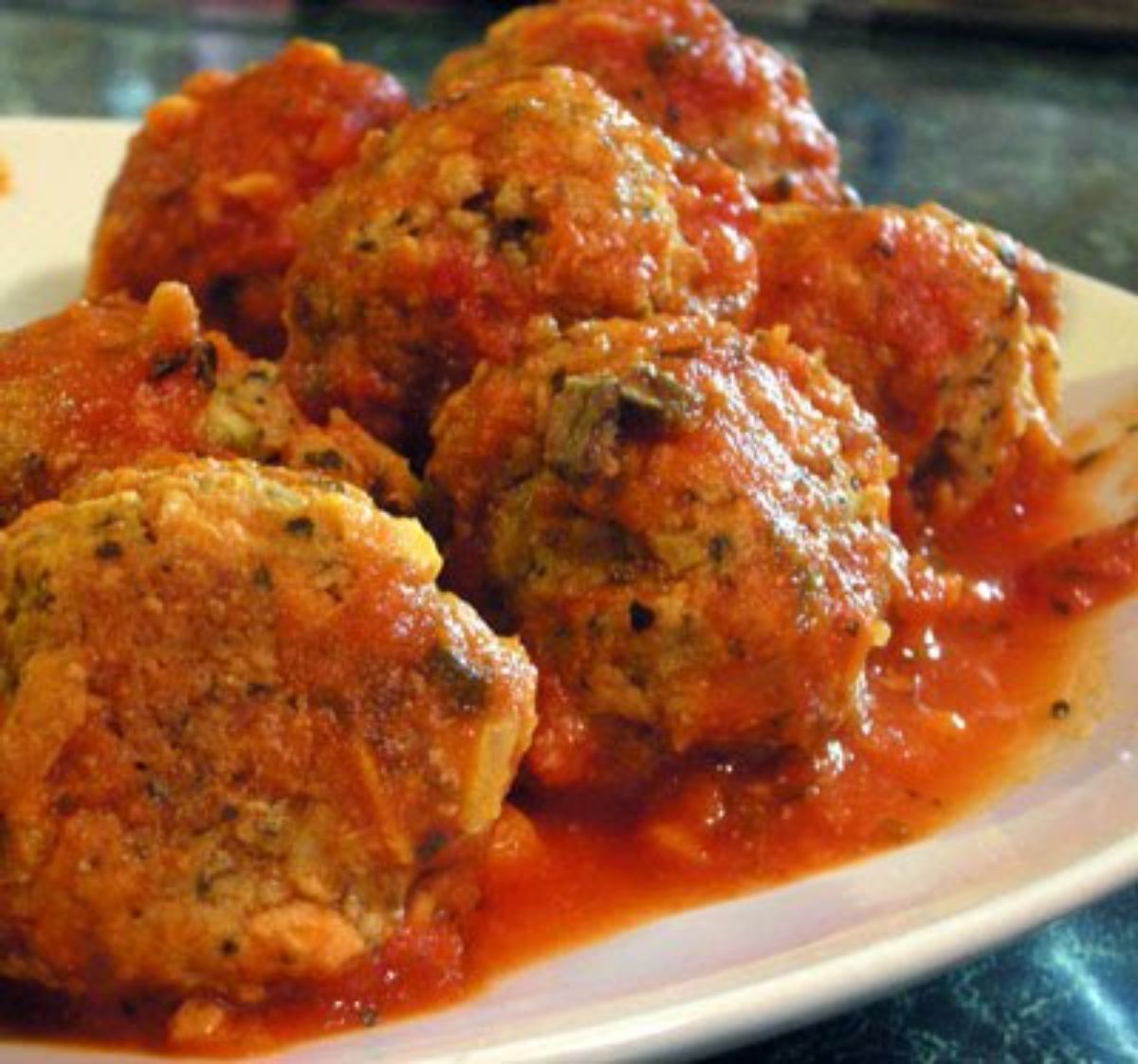 Juicy Gluten-Free Meatballs on a white plate.