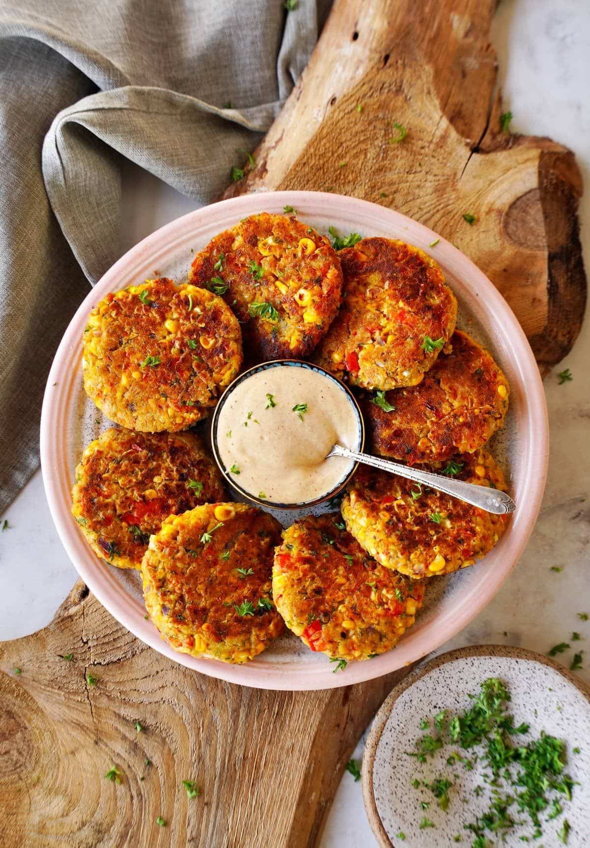 Delicious gluten-free Veggie Fritters on a pink tray.