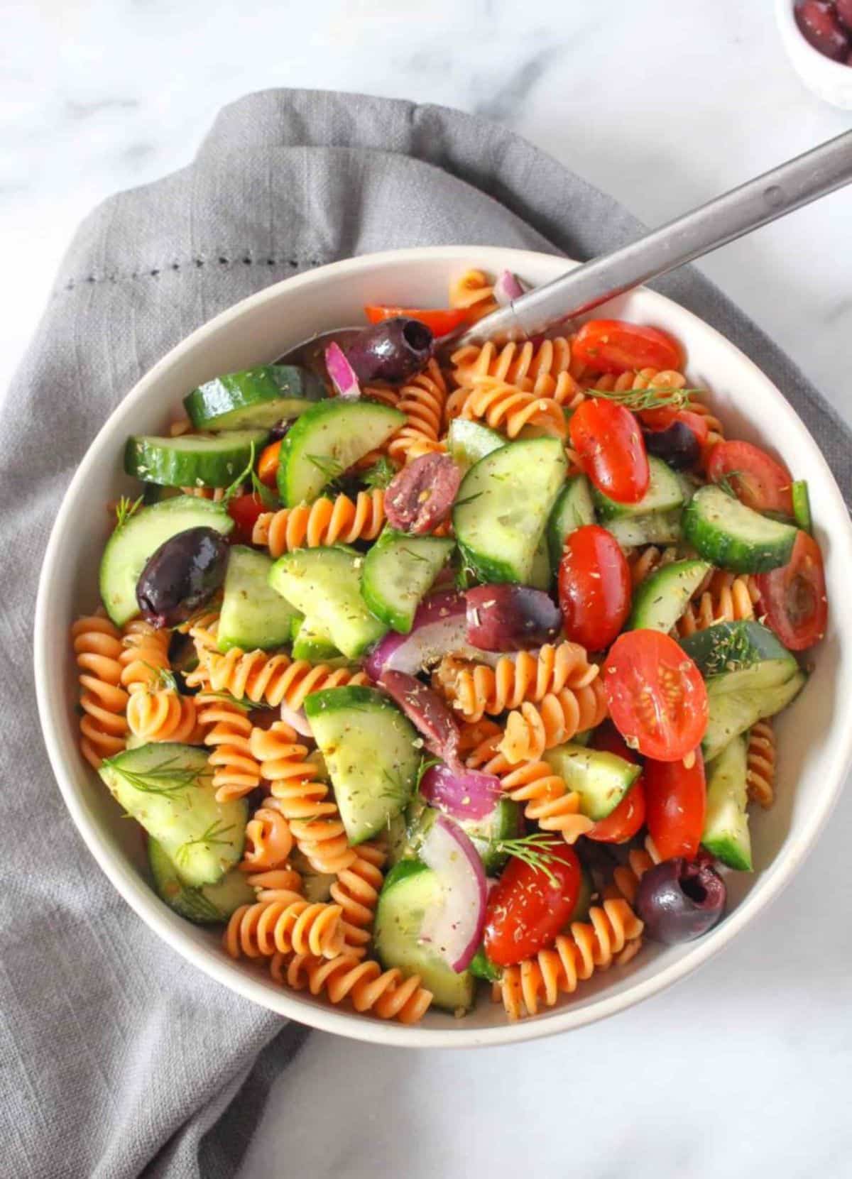 Gluten-Free Greek Pasta Salad in a white bowl.