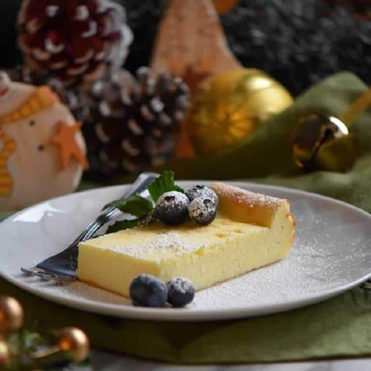 A piece of Limoncello Italian Ricotta Cake on a white plate.