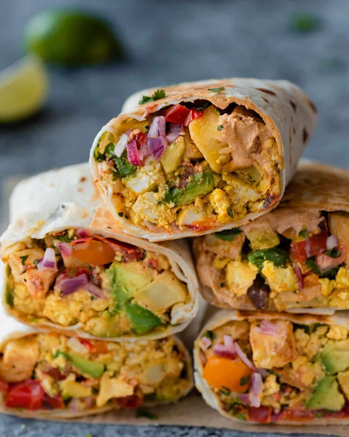 A pile of The Best Vegan Breakfast Burritos.