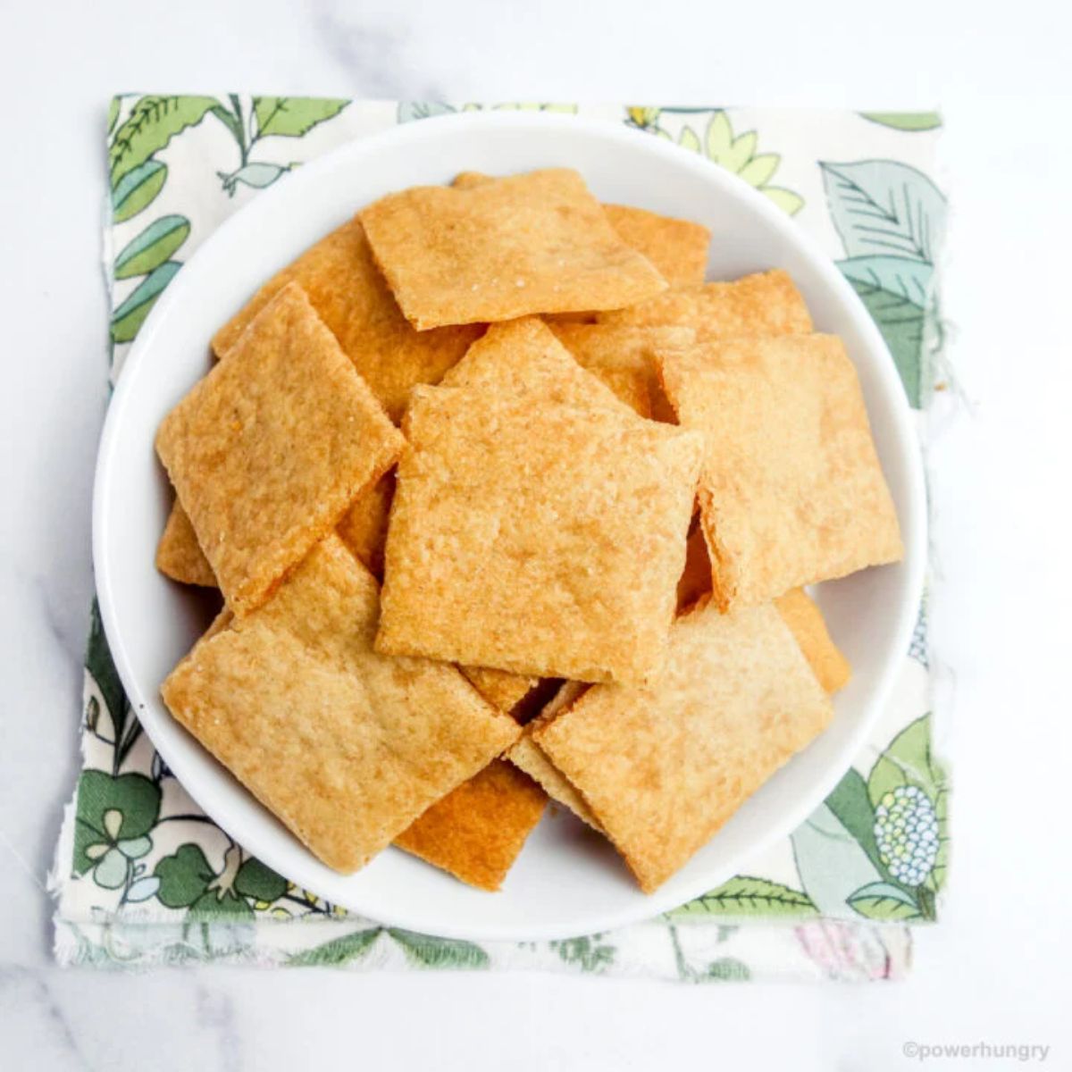 Crispy Cassava Flour Crackers on a white plate.