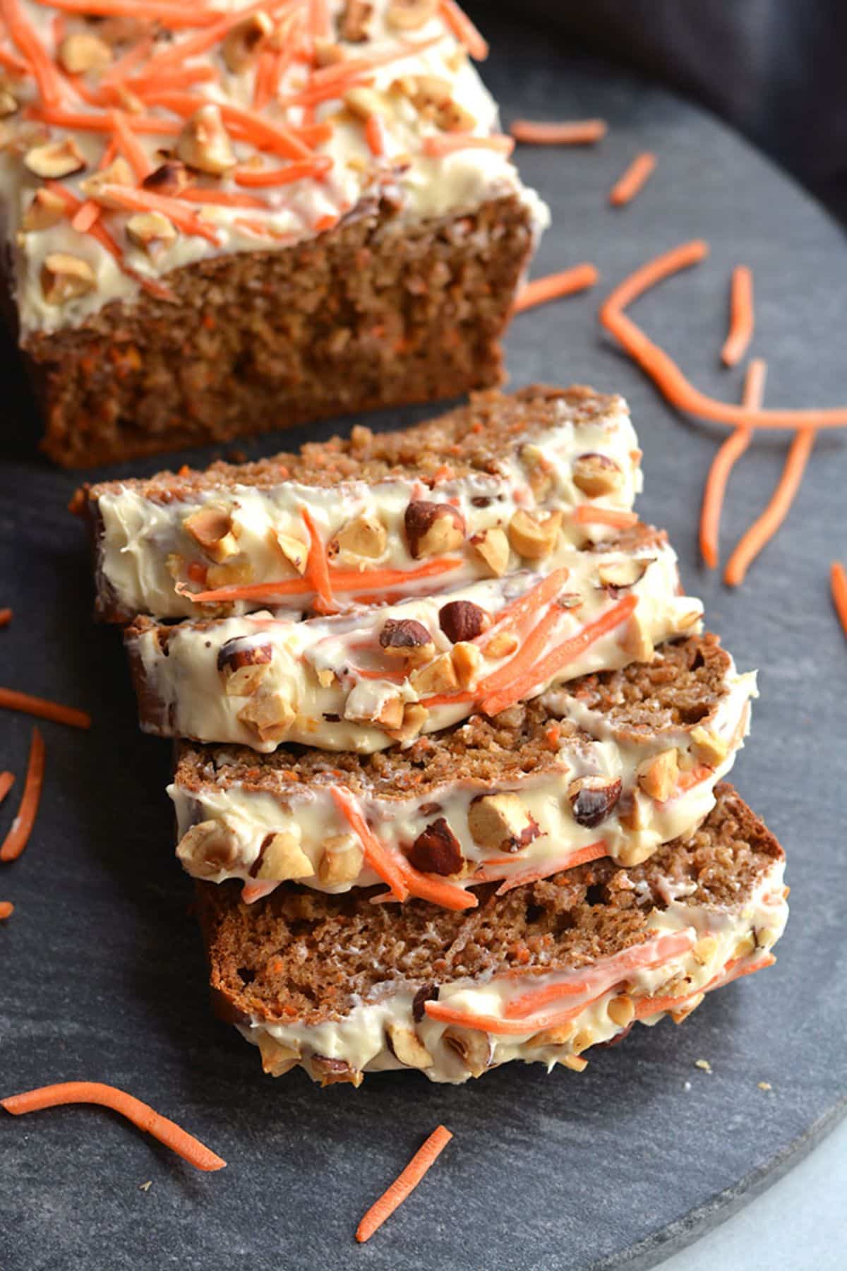 Partially sliced Gluten-Free Banana Carrot Cake Bread.