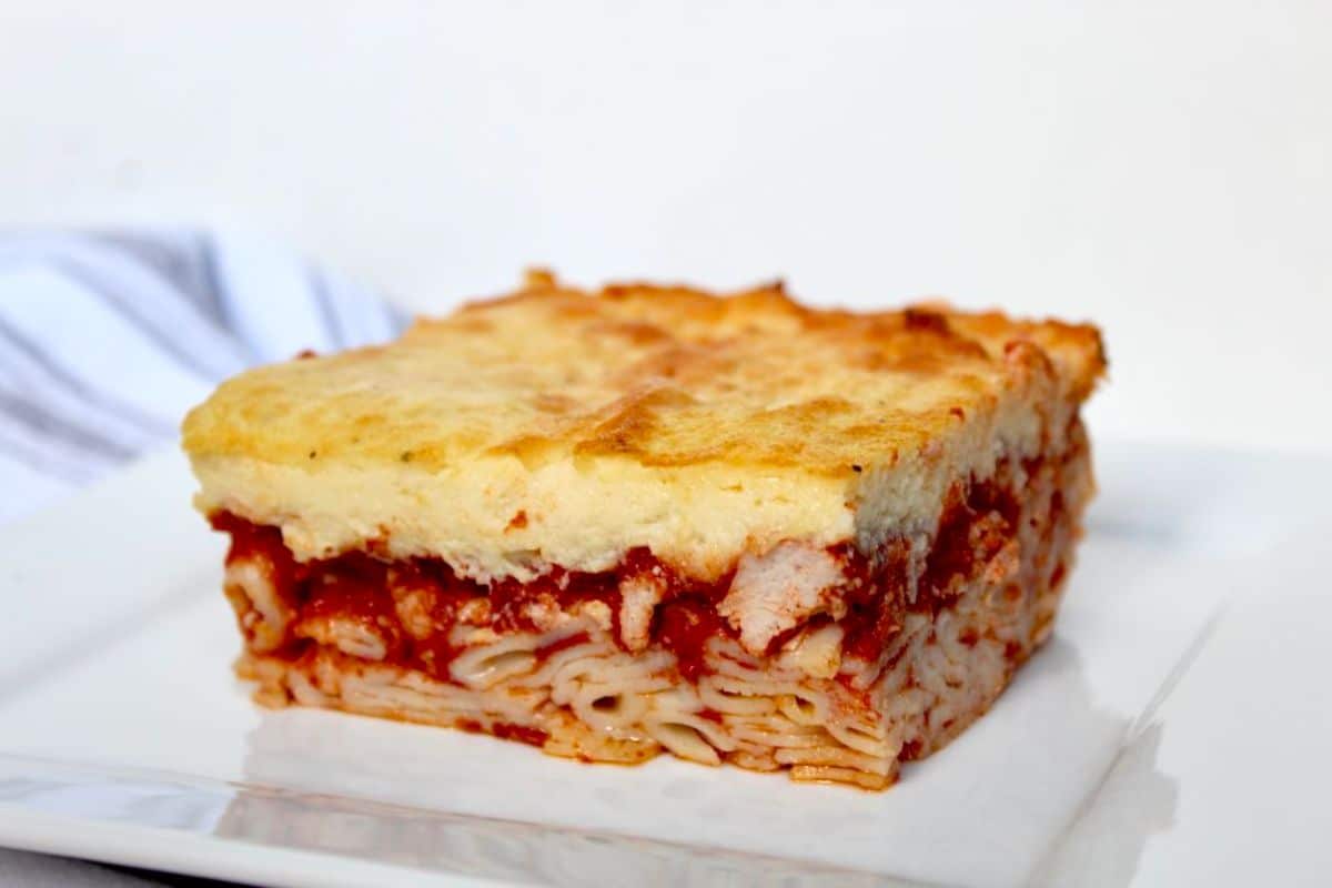 A piece of delicious Gluten-free Greek Pastitsio on a white plate.