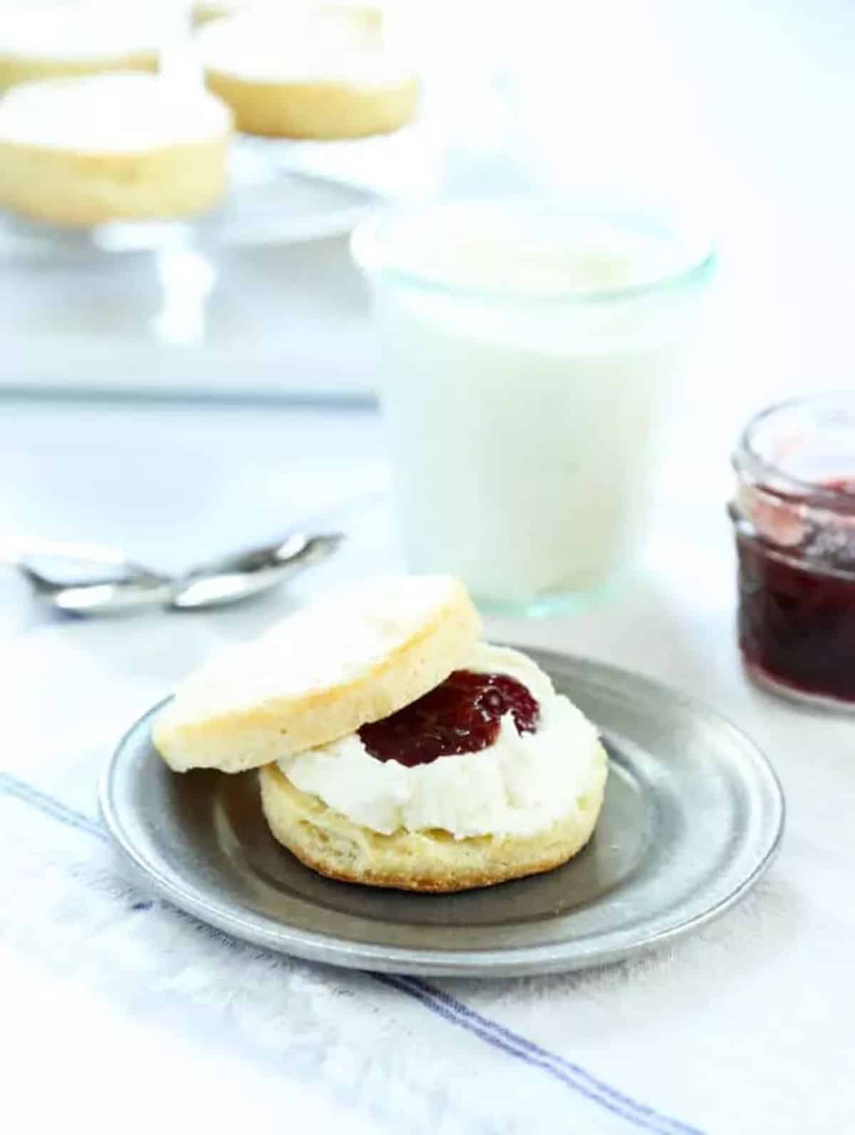 Two Tender and Flaky Gluten-Free Ricotta Biscuits on a small plate.