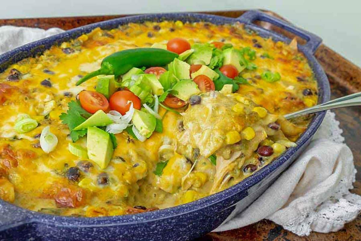 Juicy Rotisserie Chicken Enchilada in a blue casserole.