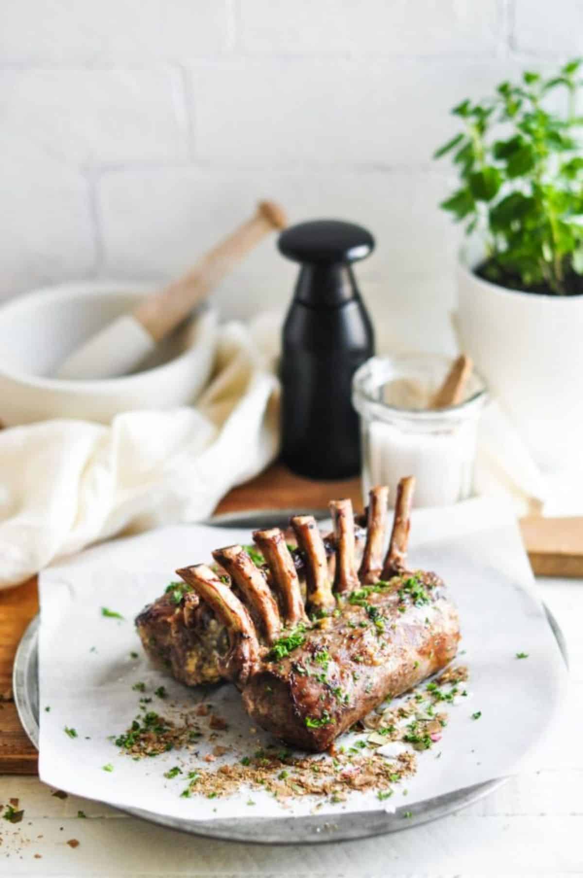 Juicy Roast Lamb Racks with Lemon and Garlic on a plate.