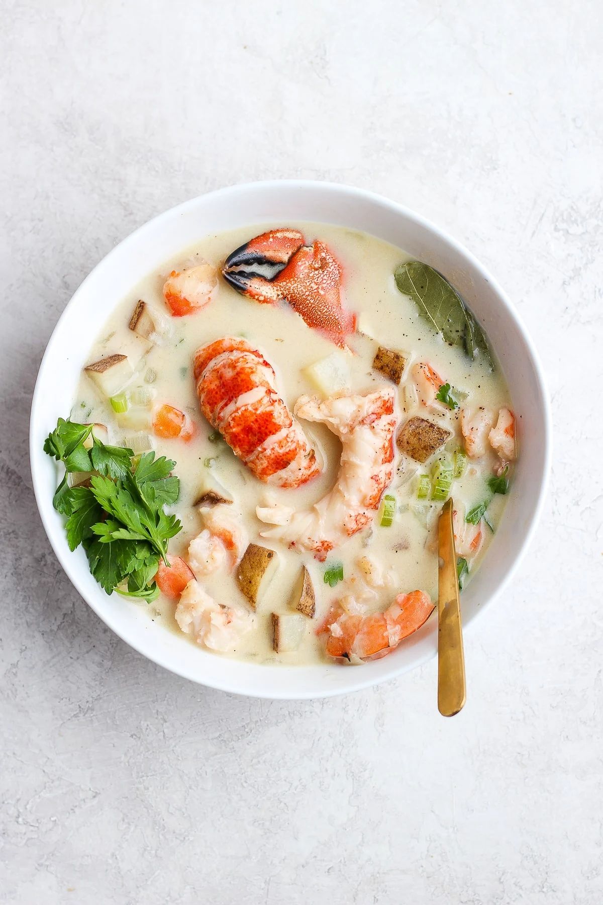 Ultimate Dairy-Free Chunky Seafood Chowder in a white bowl.