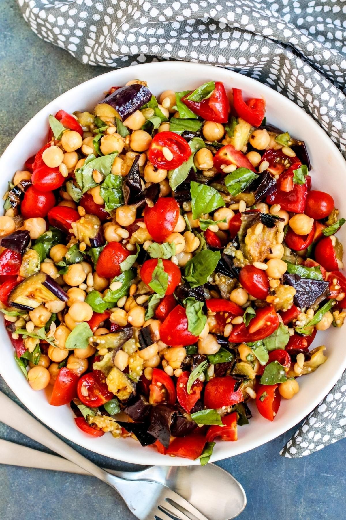 Healthy Grilled Eggplant Salad in a white bowl.