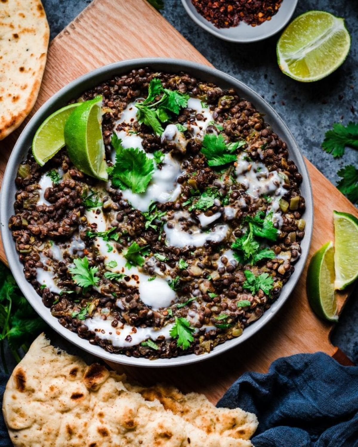 Scrumptious Indian-Spiced Black Beluga Lentils on a gray plate.