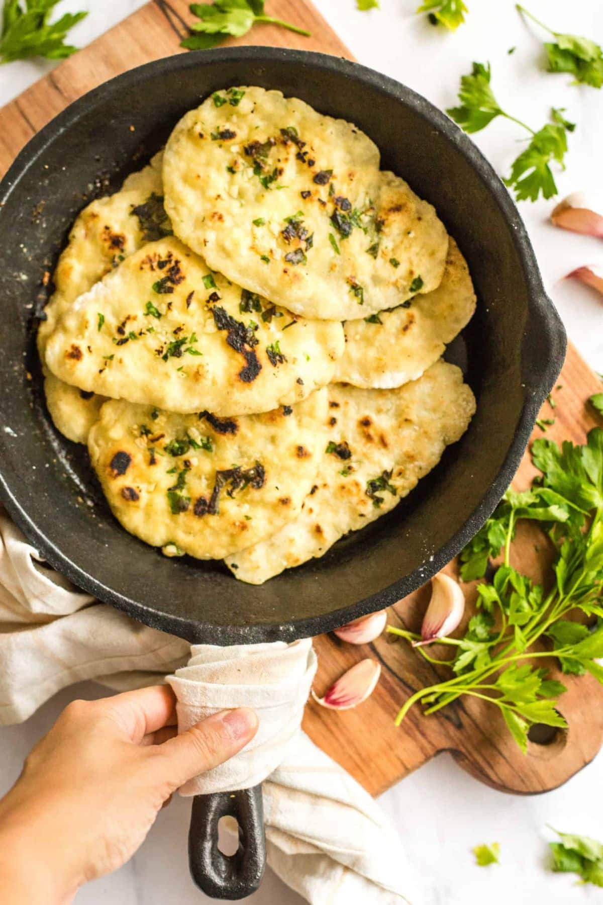 Scrumptious Naan Bread in a black skillet.