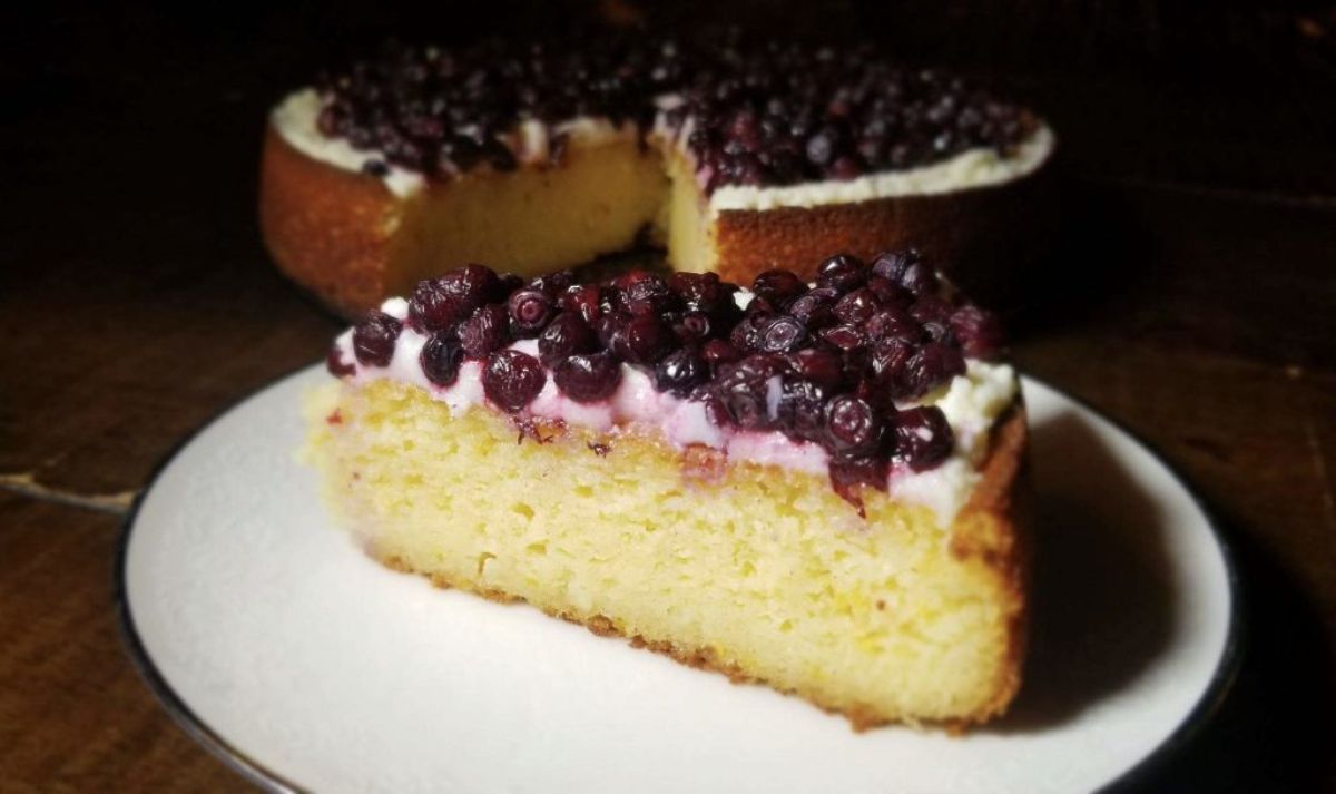 A piece of Gluten-Free Ricotta Cake on a white plate.