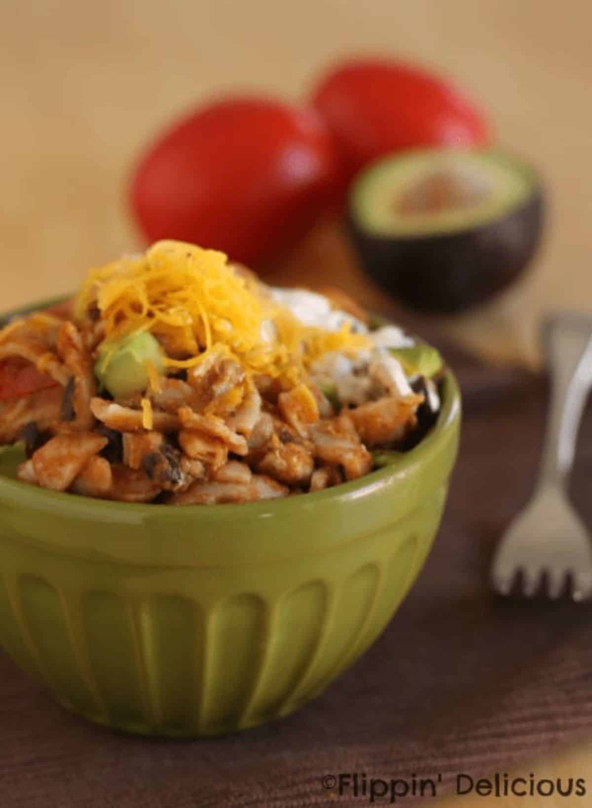 Tasty Gluten-Free One-Pot Chicken Taco Pasta in a green bowl.