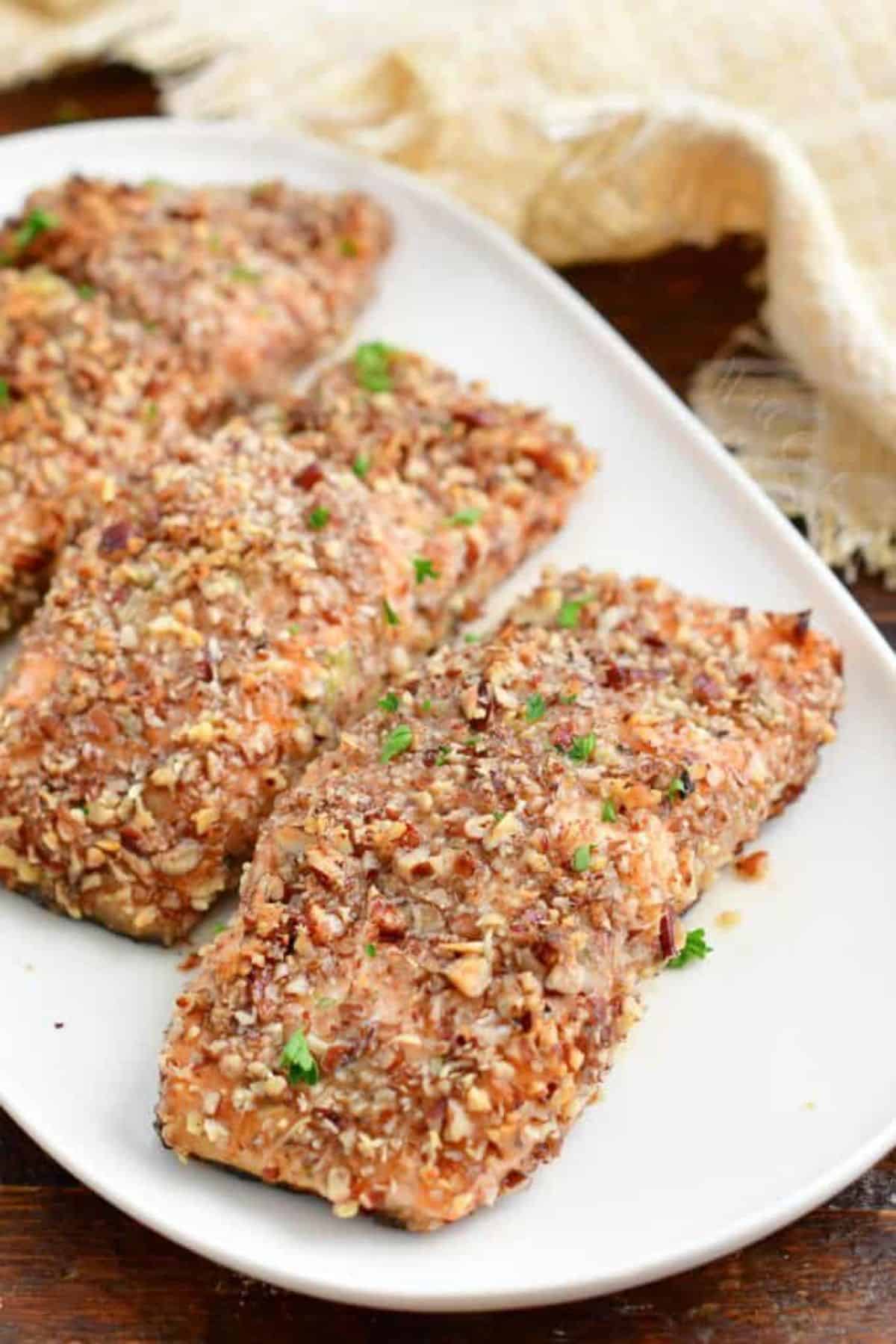 Delicious Pecan Crusted Salmon on a white tray.