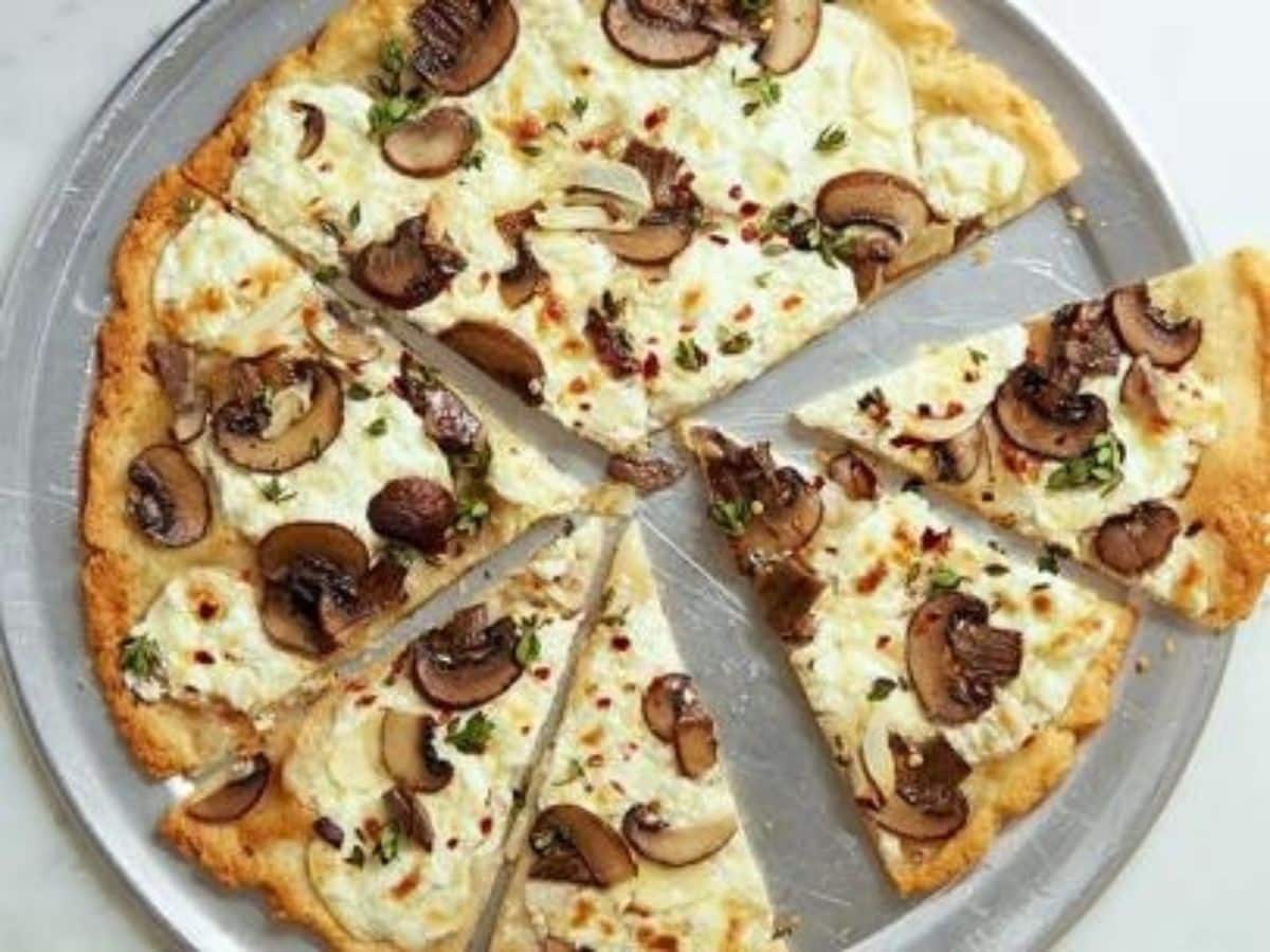 Delicious Gluten-Free Mushroom and Ricotta Pizza on a tray.