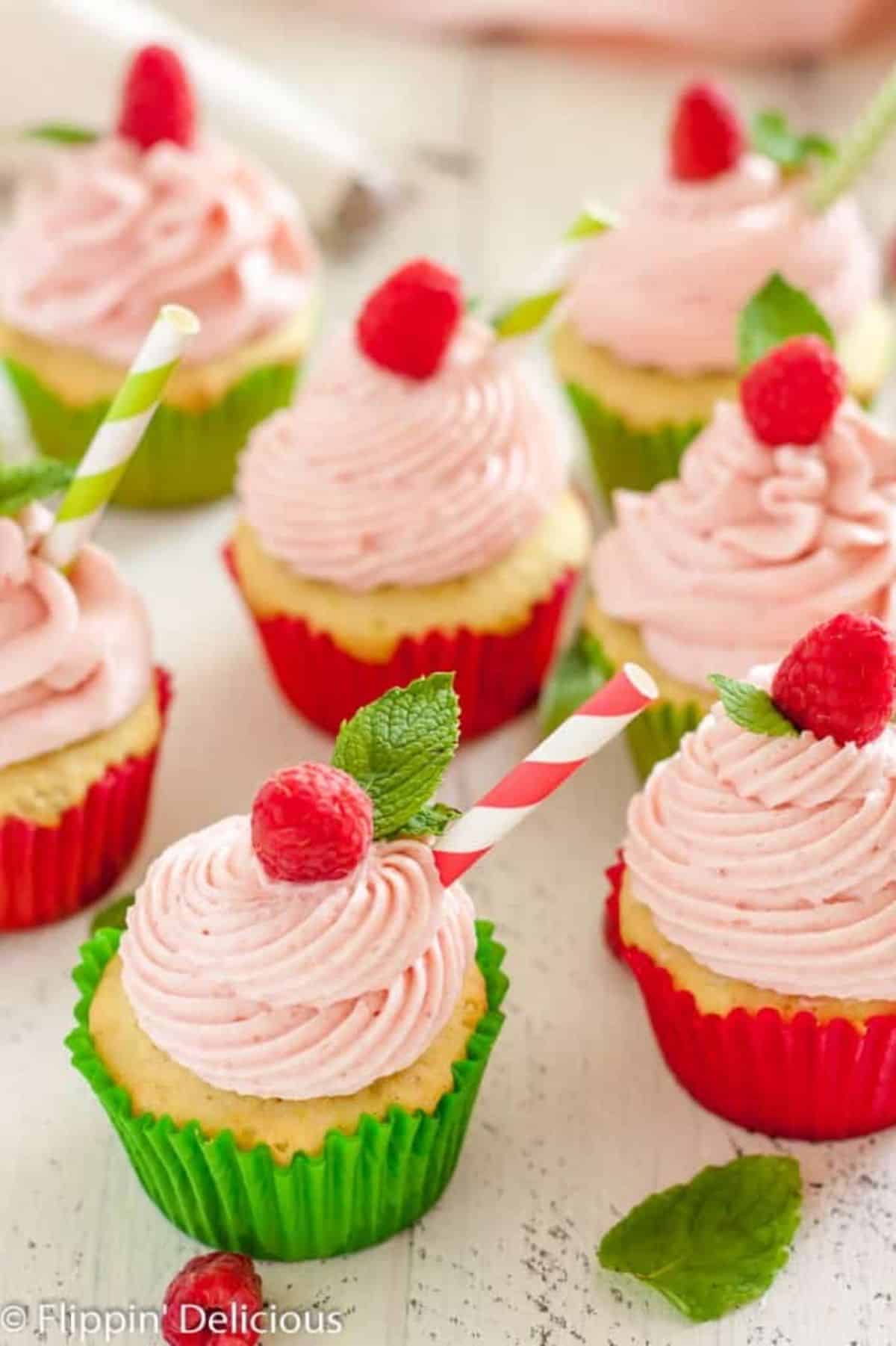 Scrumptious Gluten-Free Raspberry Lime Mojito Cupcakes on a table.