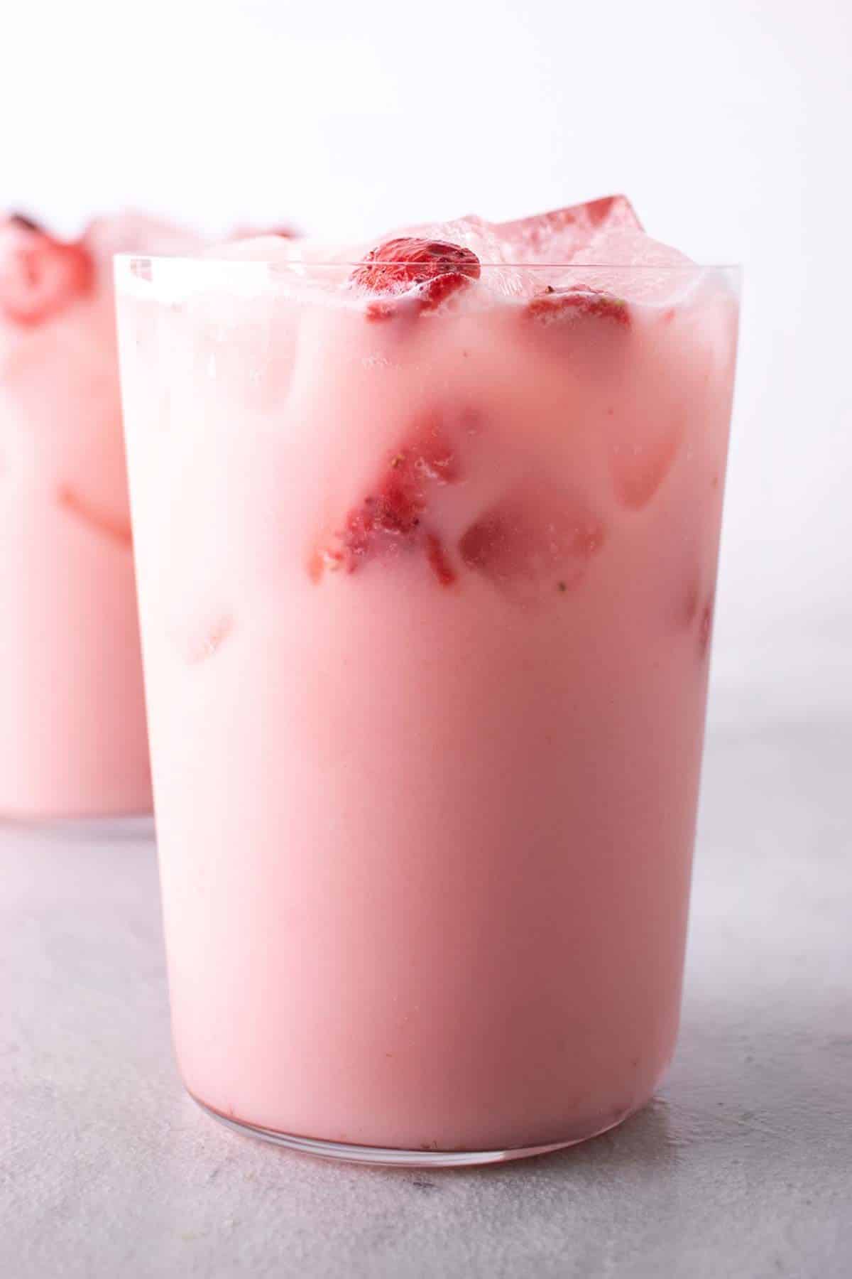 Deliicous Starbucks Pink Drink in a glass cup.