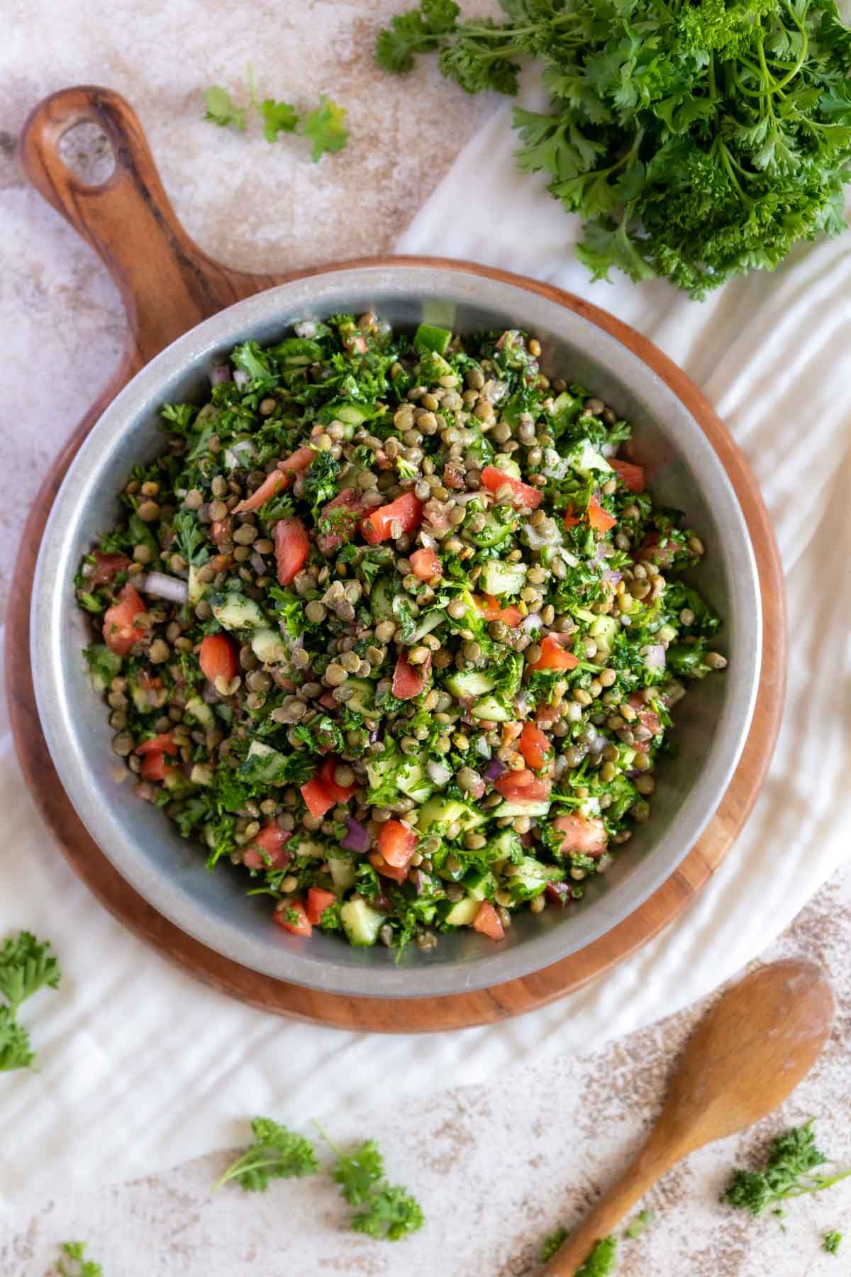 Flavorful Lentil Tabbouleh Salad in a gray bowl.