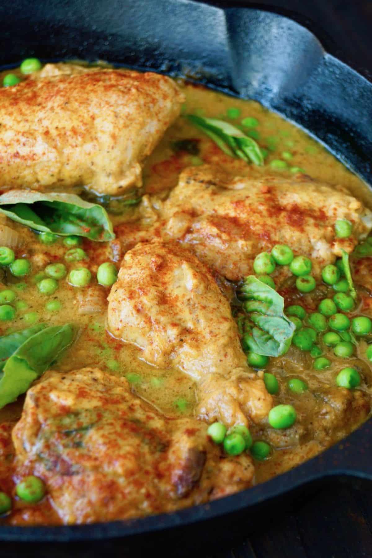 Juicy Sweet Potato Chicken in a black skillet.