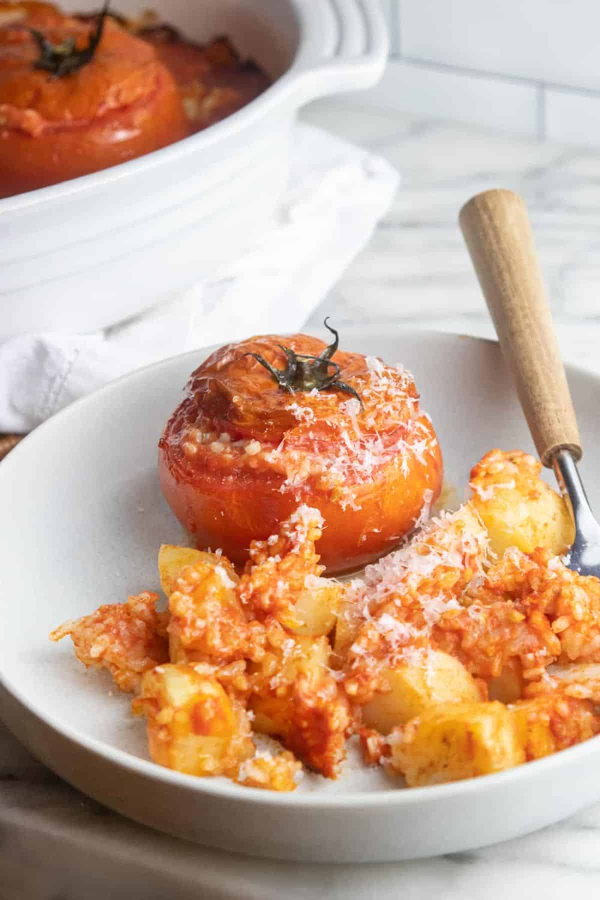 Flavorful Pomodori Al Riso in a white bowl.