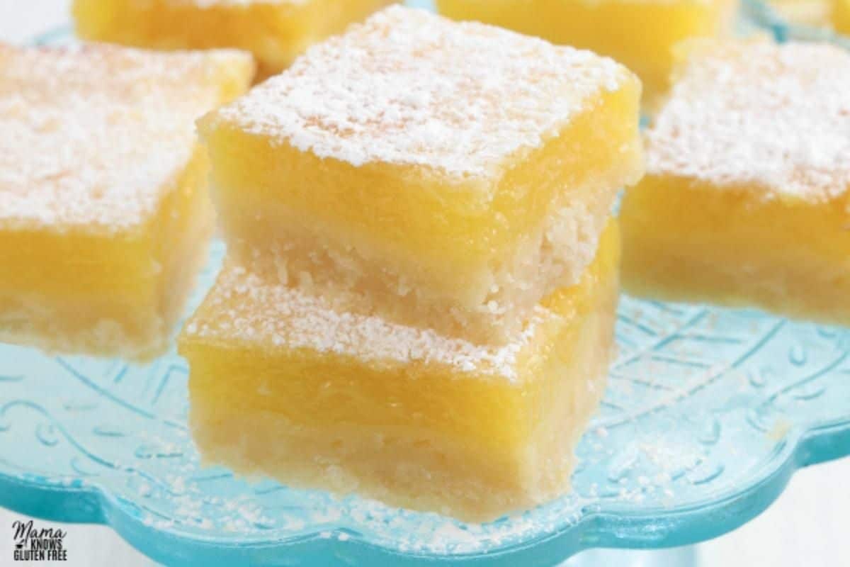 Flavorful Gluten-Free Lemon Bars on a cake tray.