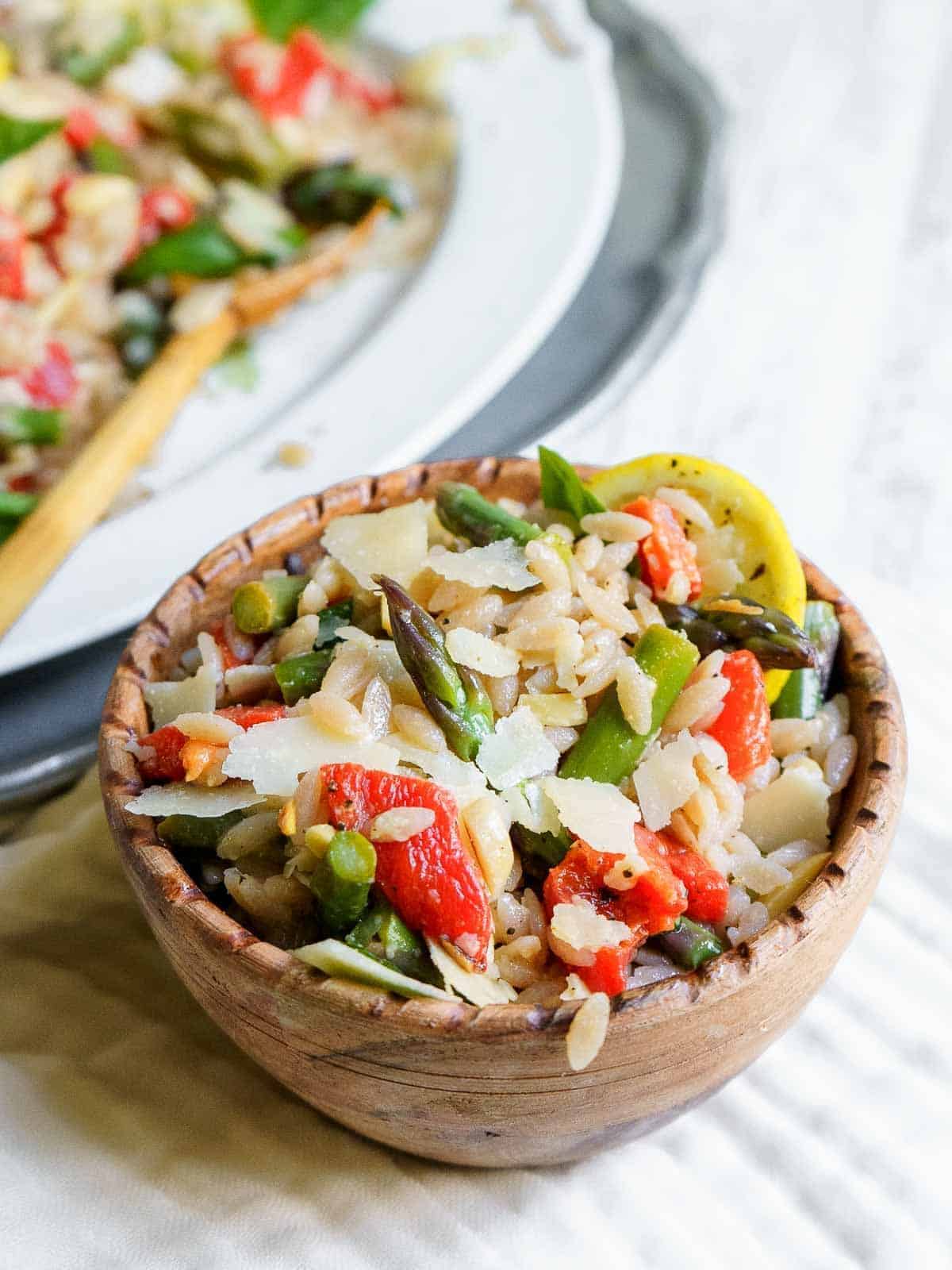 Scrumptious gluten-free Lemon Orzo Salad in a wooden bowl.