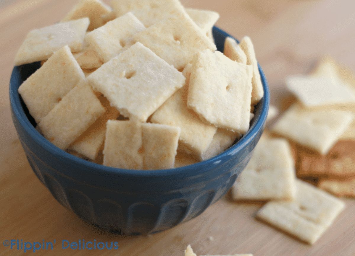 Crispy Gluten-Free White Cheddar Crackers in a blue bowl.