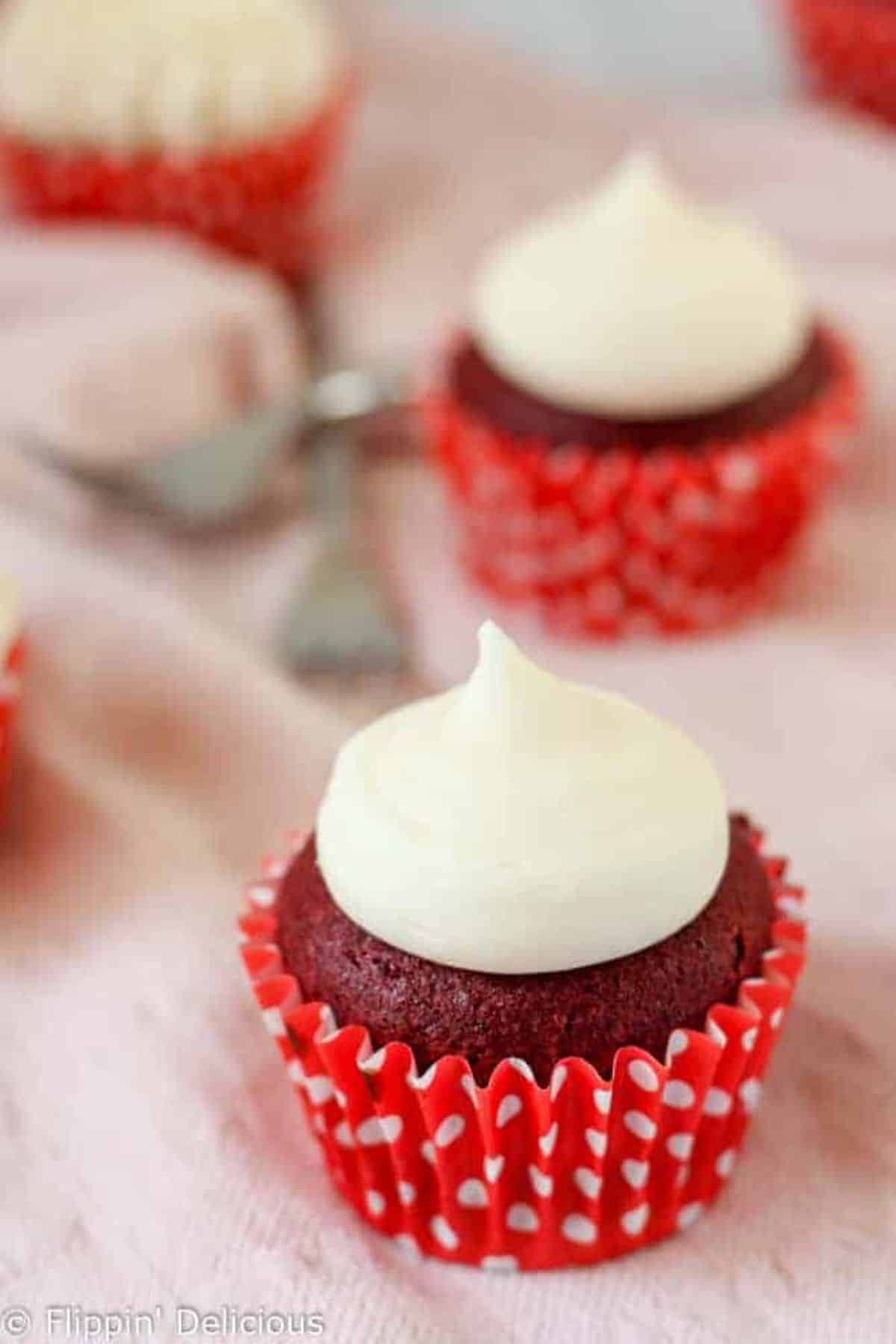 Scrumptious Gluten-Free Red Velvet Cupcakes on a table.