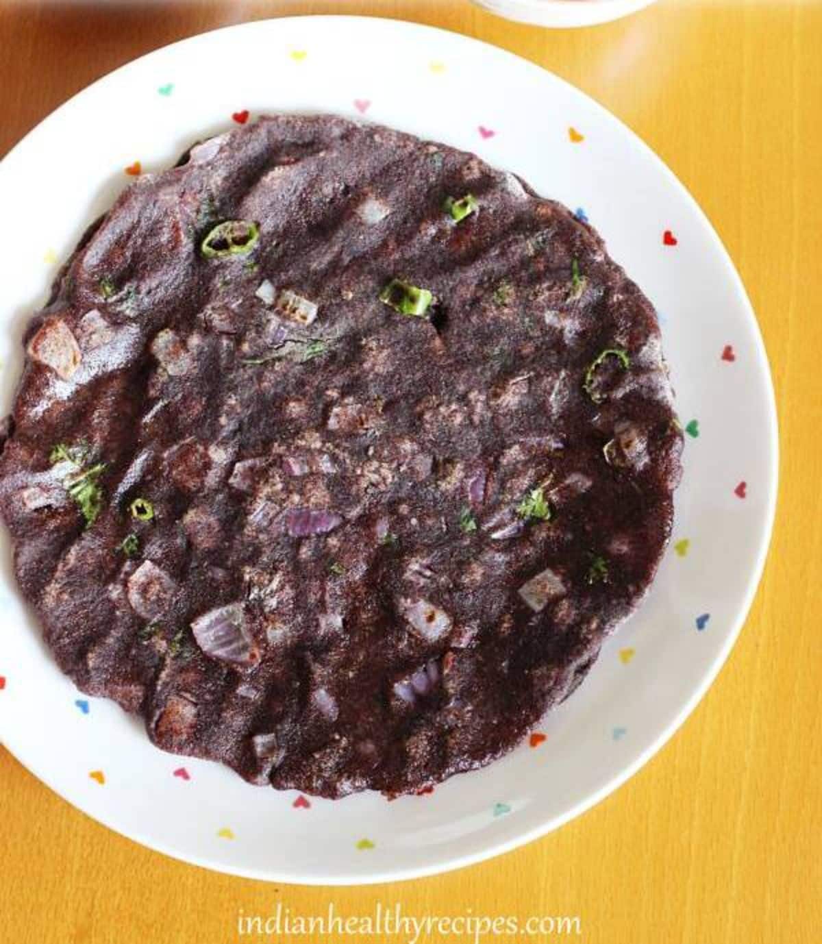 Healthy gluten-free Ragi Roti on a white plate.