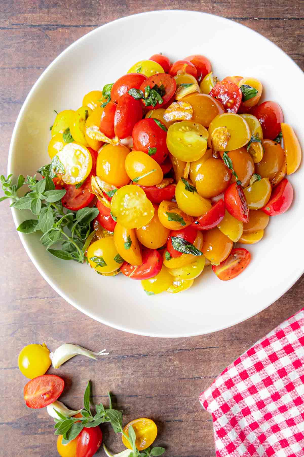 Fresh gluten-free Cherry Tomato Salad on a white plate.