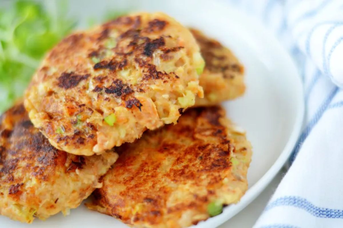 Scrmptious gluten-free Sweet Potato Salmon Patties on a white plate.