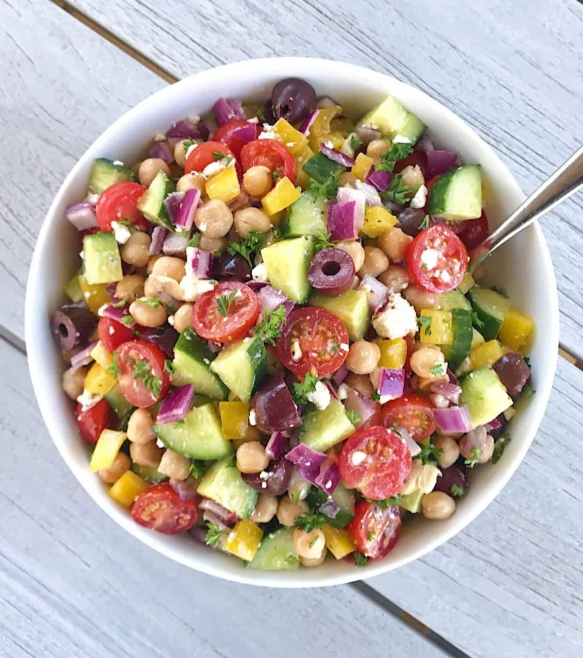 Delicious gluten-free Greek Chickpea Salad in a white bowl.