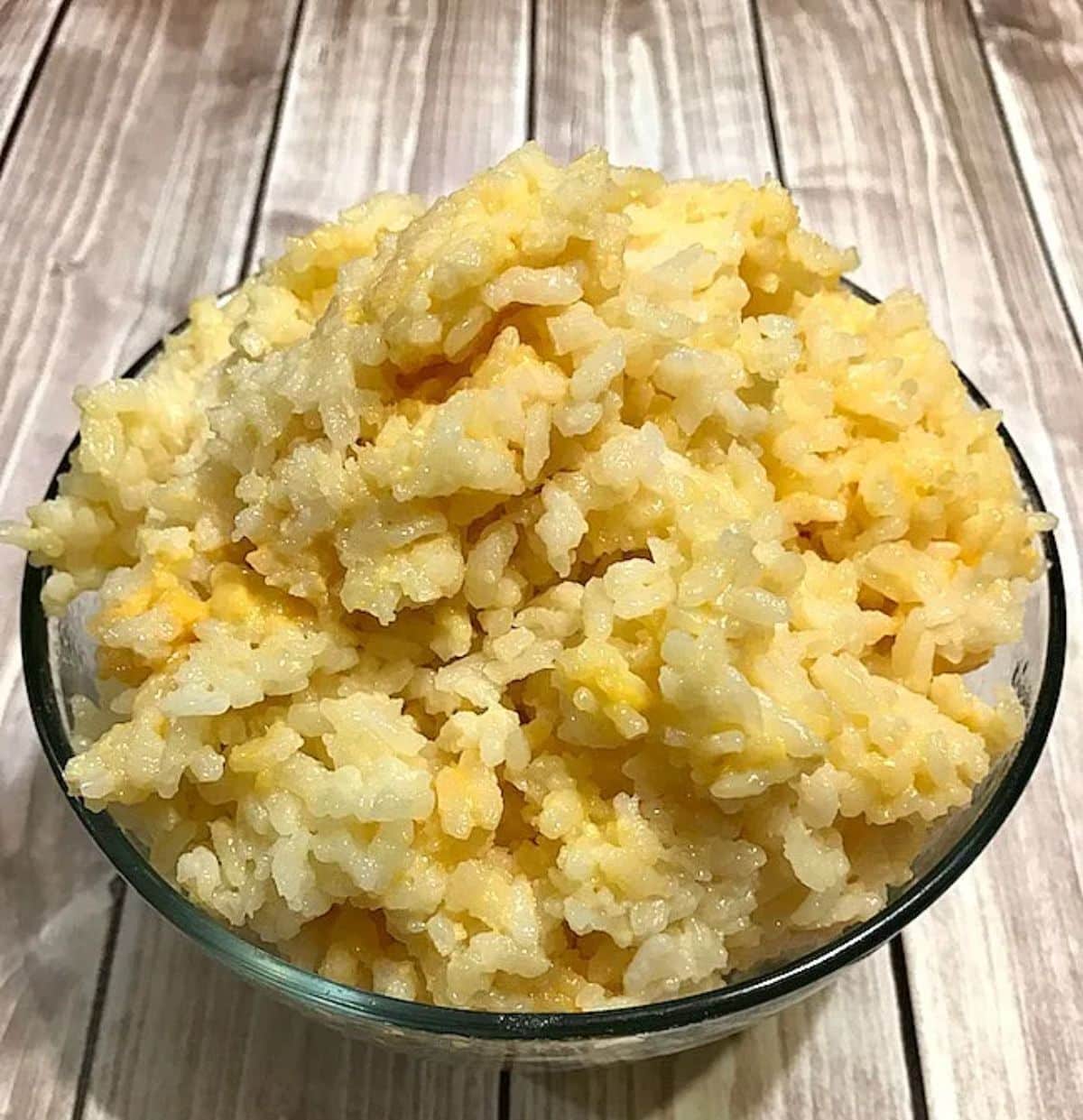 Flavorful Gluten-Free Instant Pot Cheesy Rice in a glass bowl.