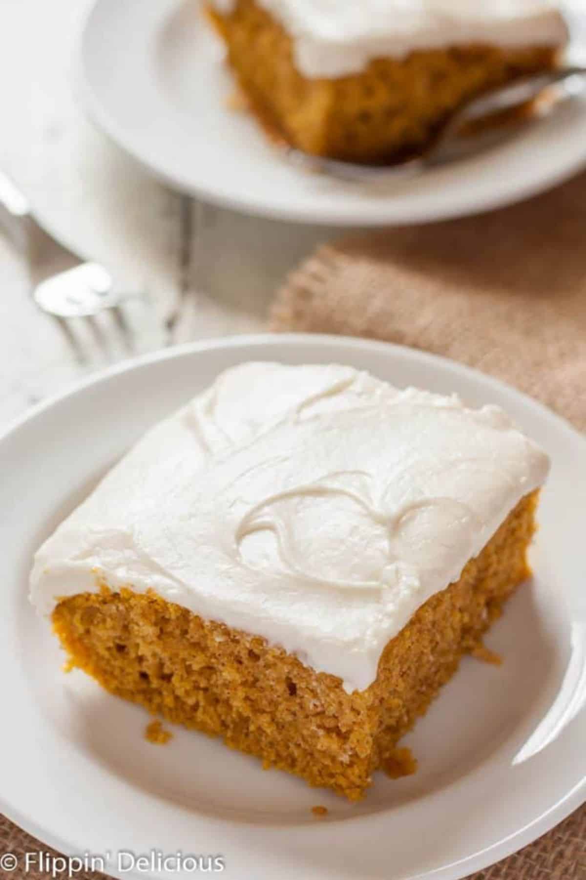 A piece of delicious Pumpkin Cake on a white plate.