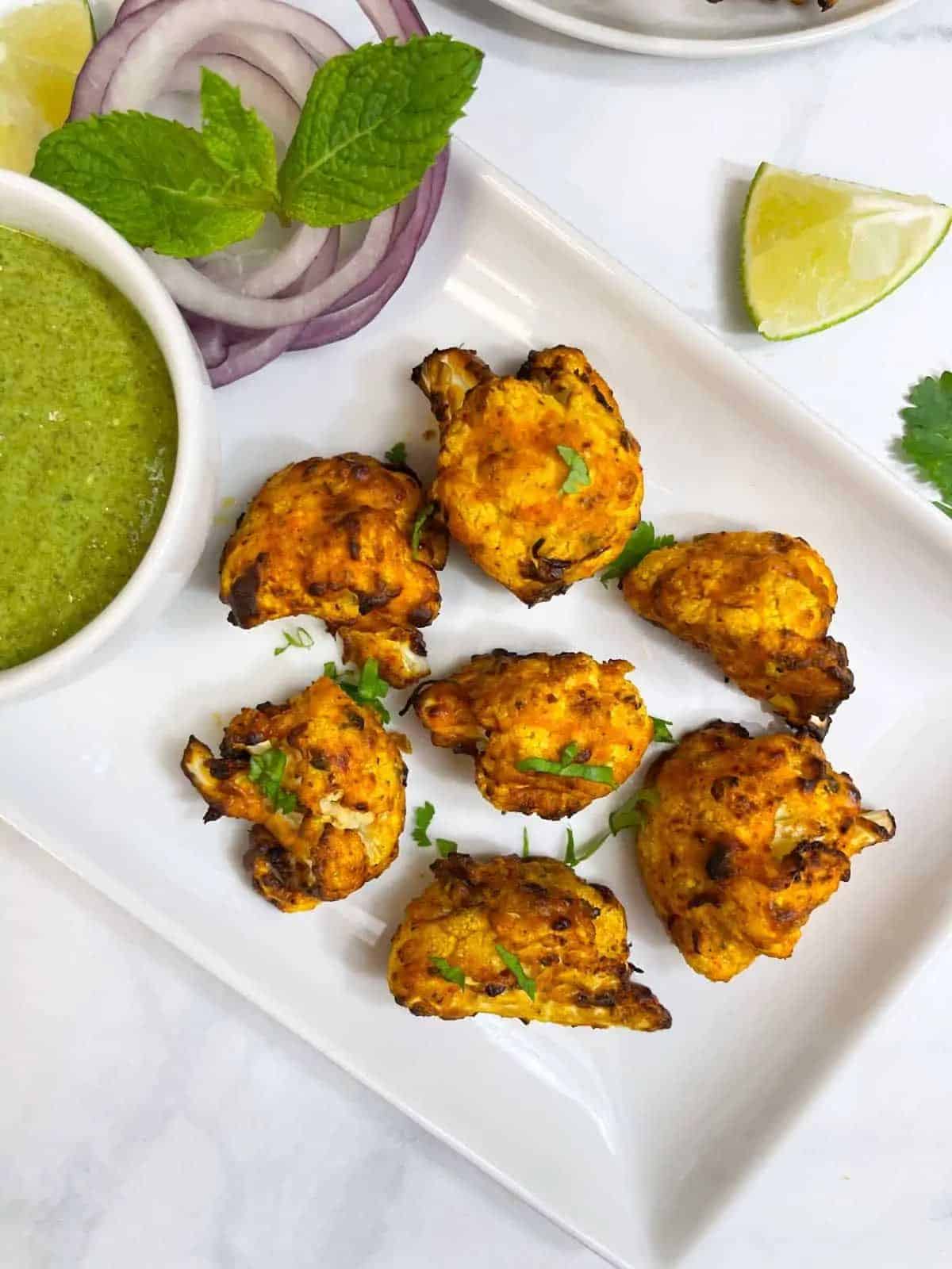 Scrumptious Air Fryer Tandoori Gobi on a white tray.